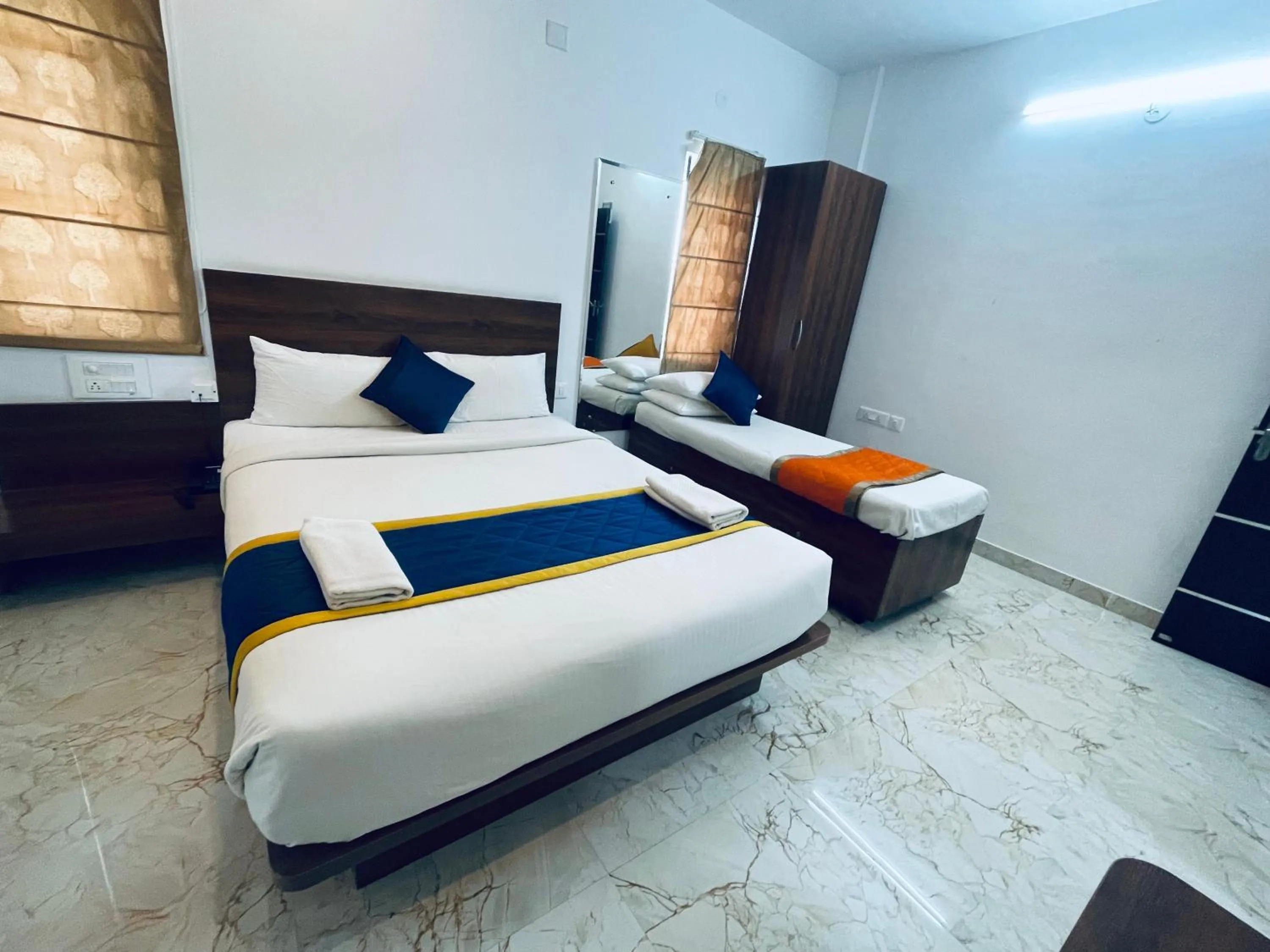 Bed in Keerthis Royal Suites Hotels in Bangalore Airport