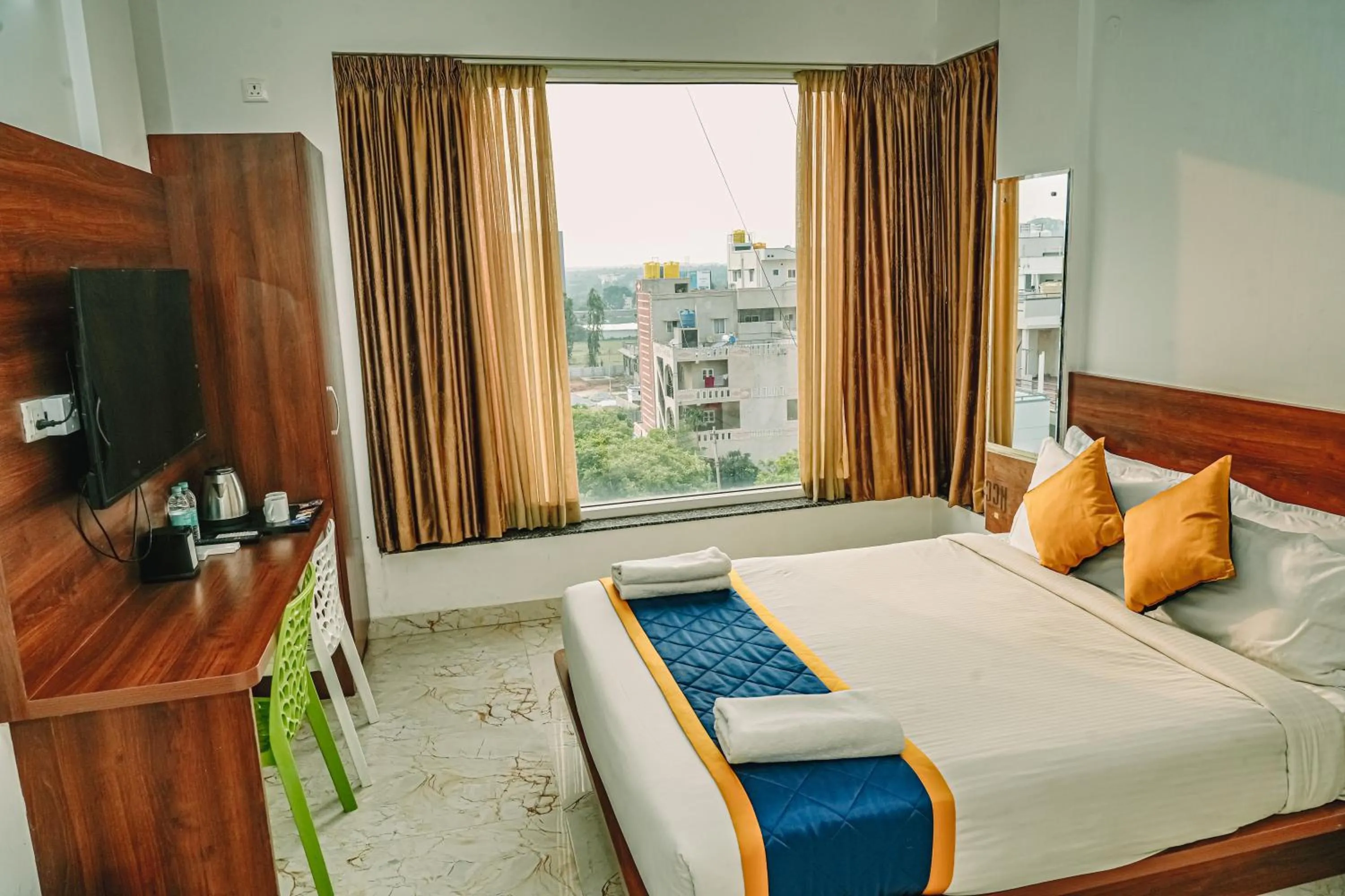 Bed in Keerthis Royal Suites -Bangalore Airport Budget Luxury Hotel