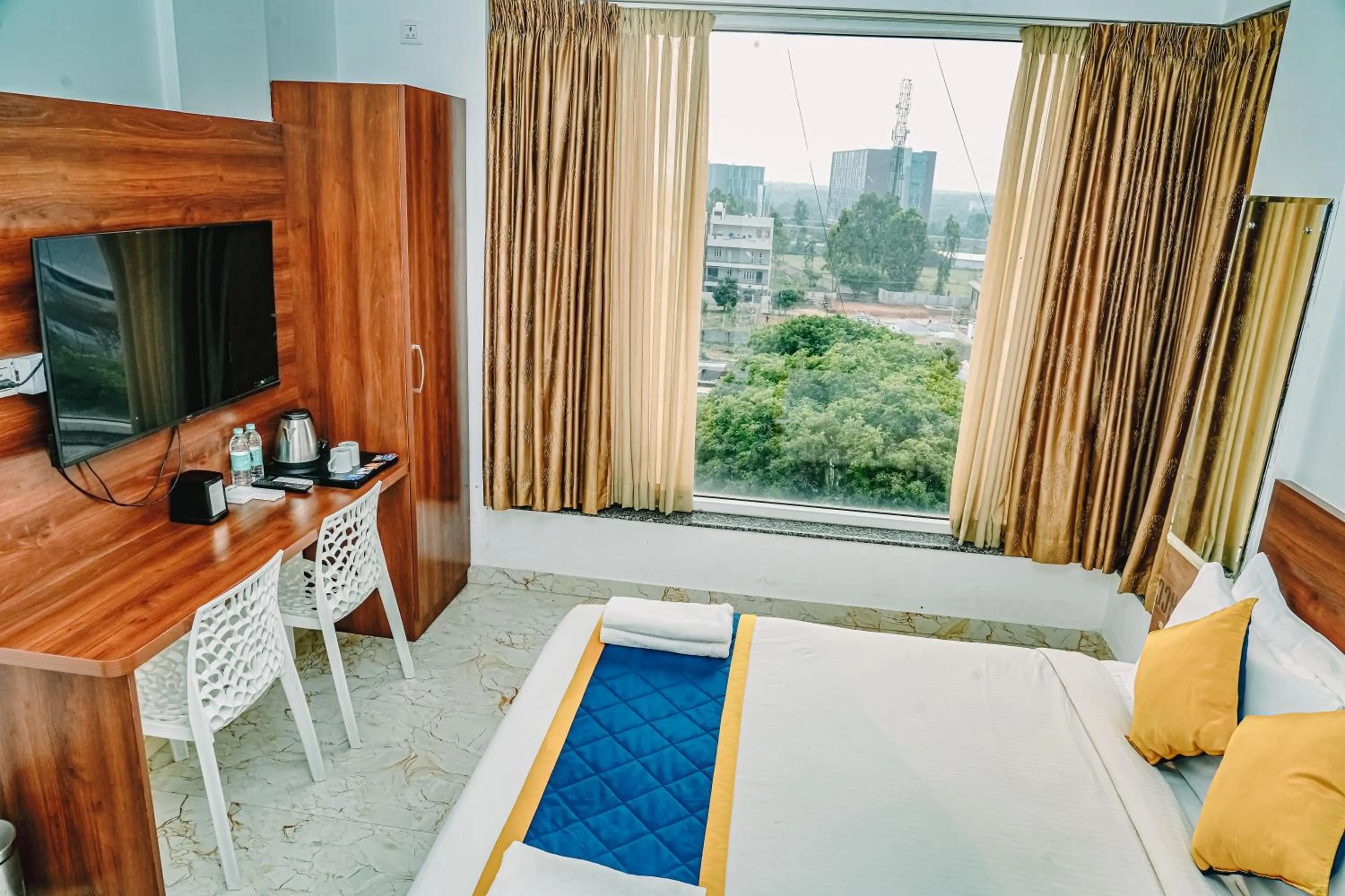 Living room, Bed in Keerthis Royal Suites -Bangalore Airport Budget Luxury Hotel