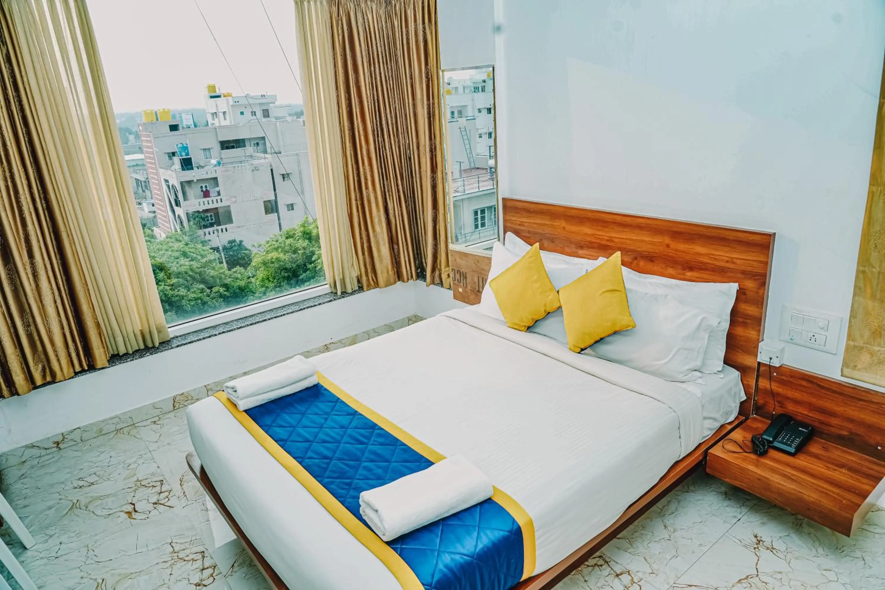 Bedroom, Bed in Keerthis Royal Suites -Bangalore Airport Budget Luxury Hotel