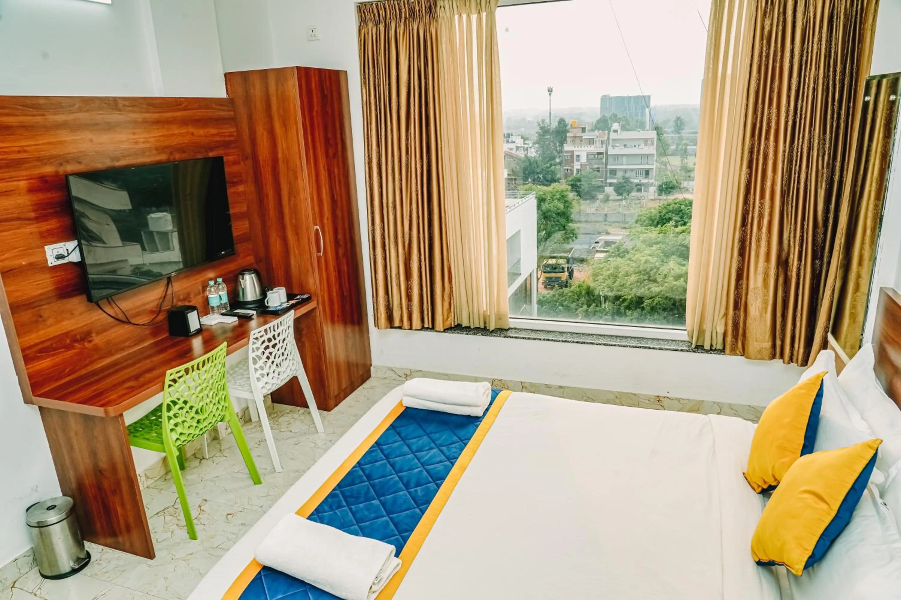 Bed in Keerthis Royal Suites -Bangalore Airport Budget Luxury Hotel