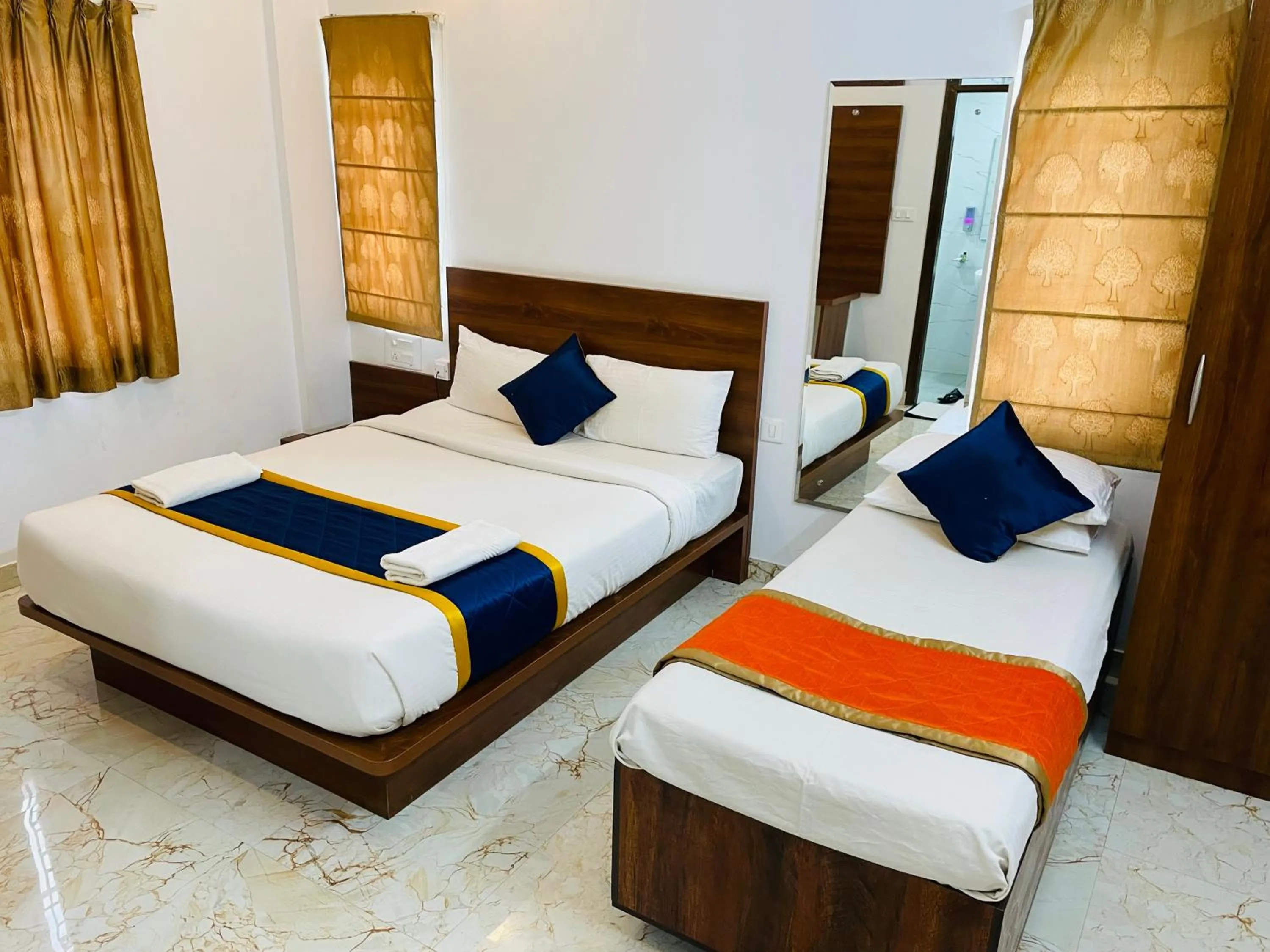 Bed in Keerthis Royal Suites Hotels in Bangalore Airport