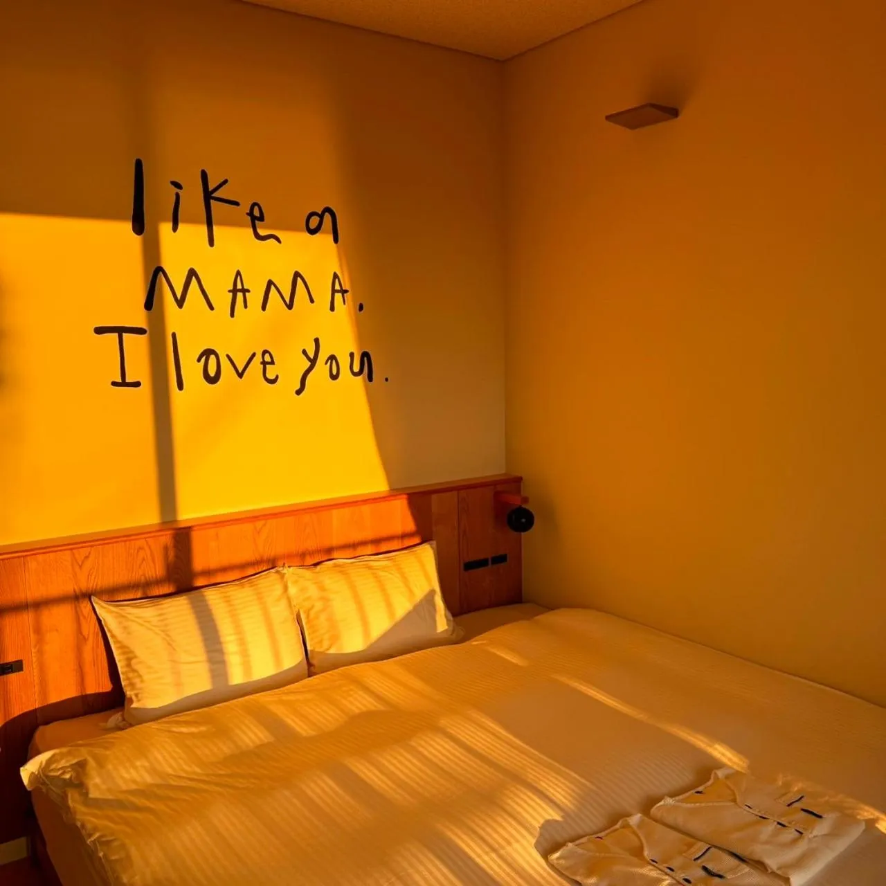 Bed in KAMOME SLOW HOTEL the COMPACT