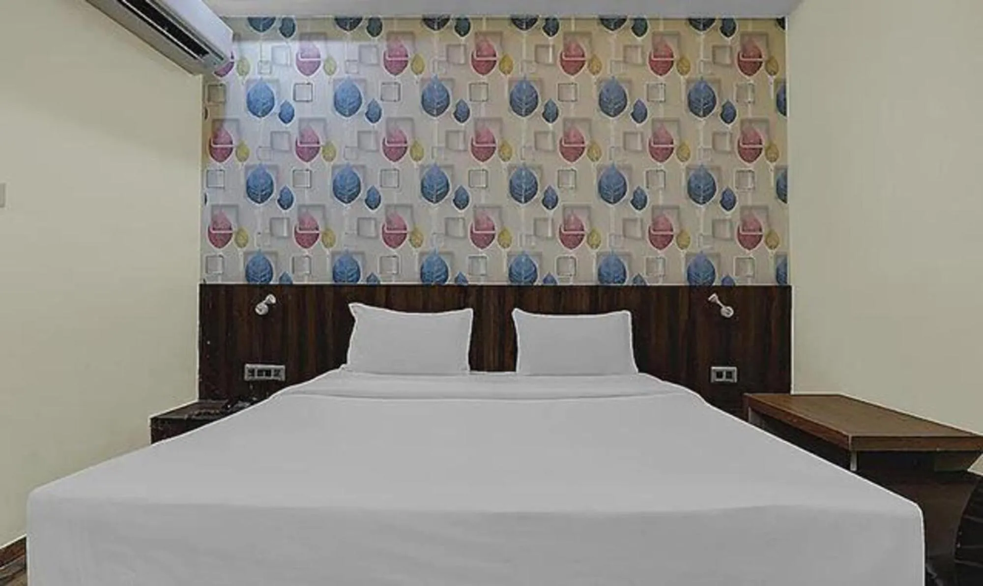 Bed in FabHotel Sam Inn