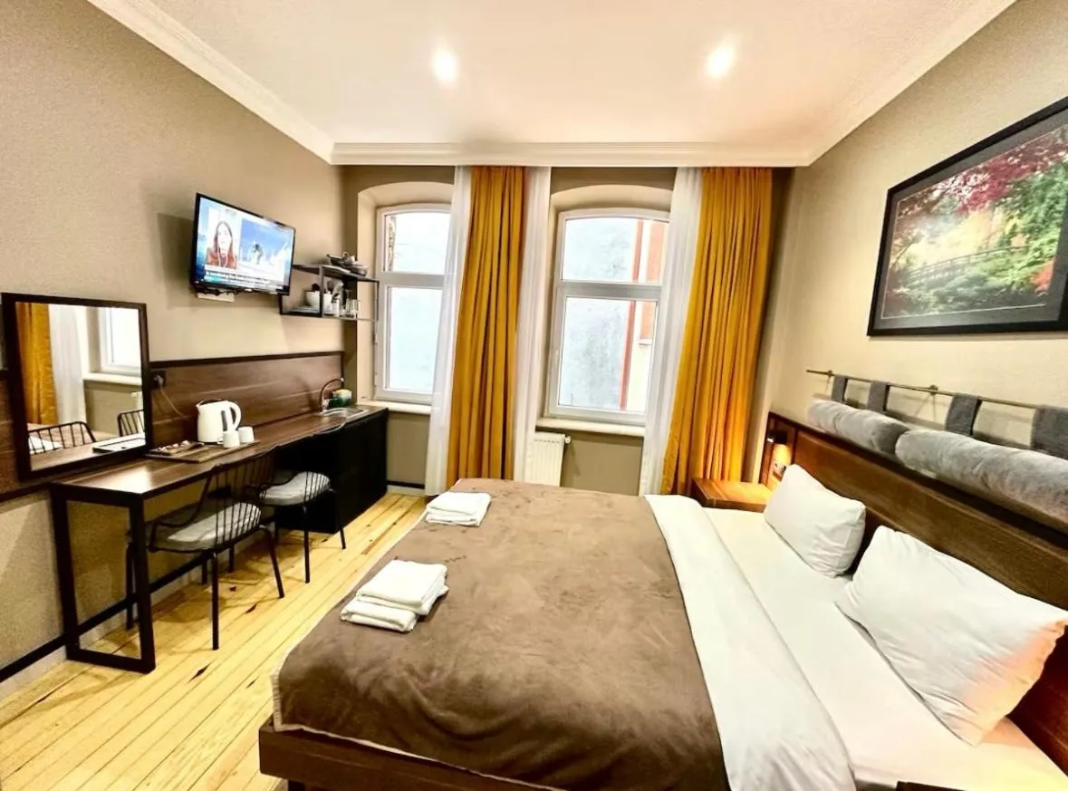 Bed in Aram Kerasi Rooms