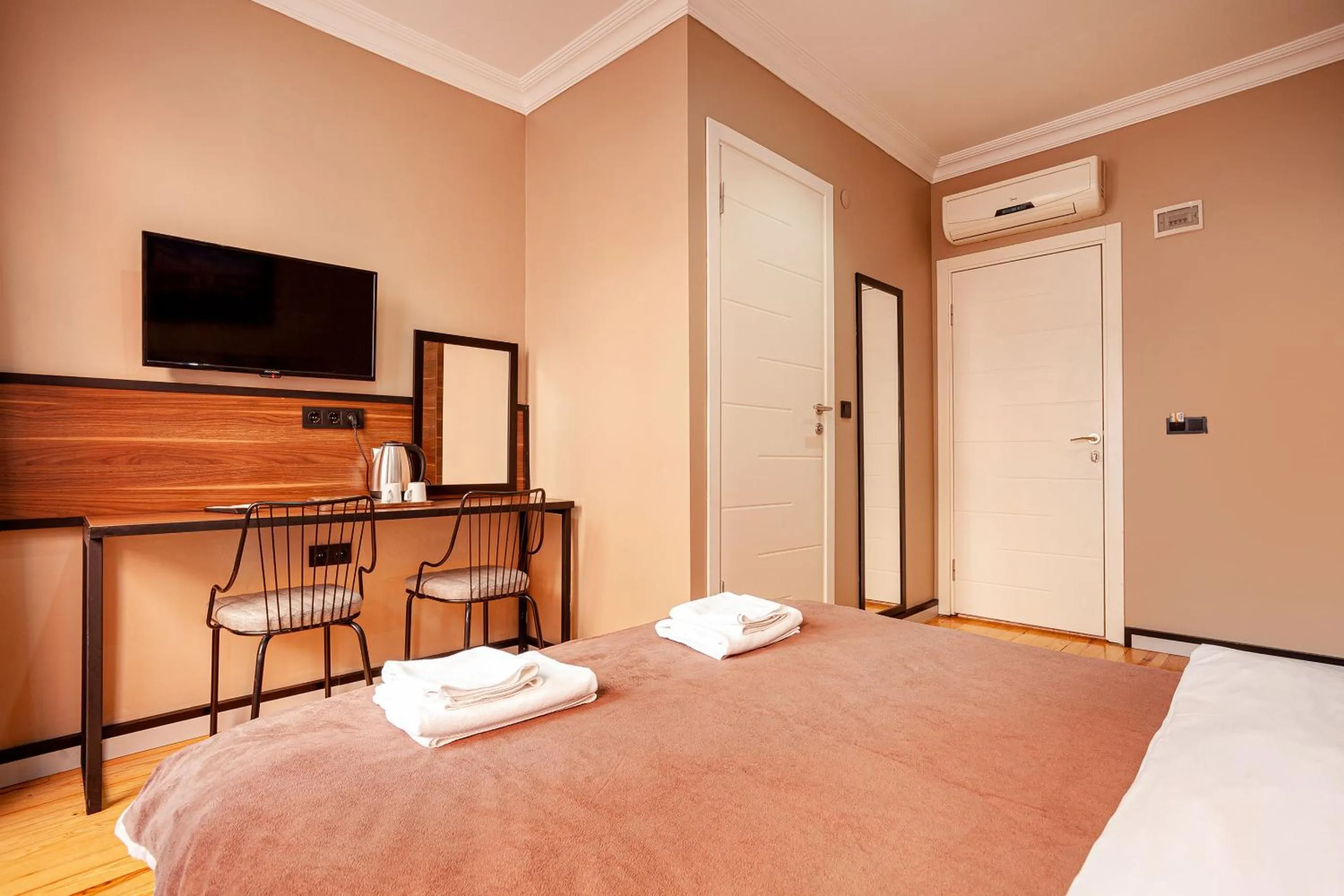 Bed in Aram Kerasi Rooms