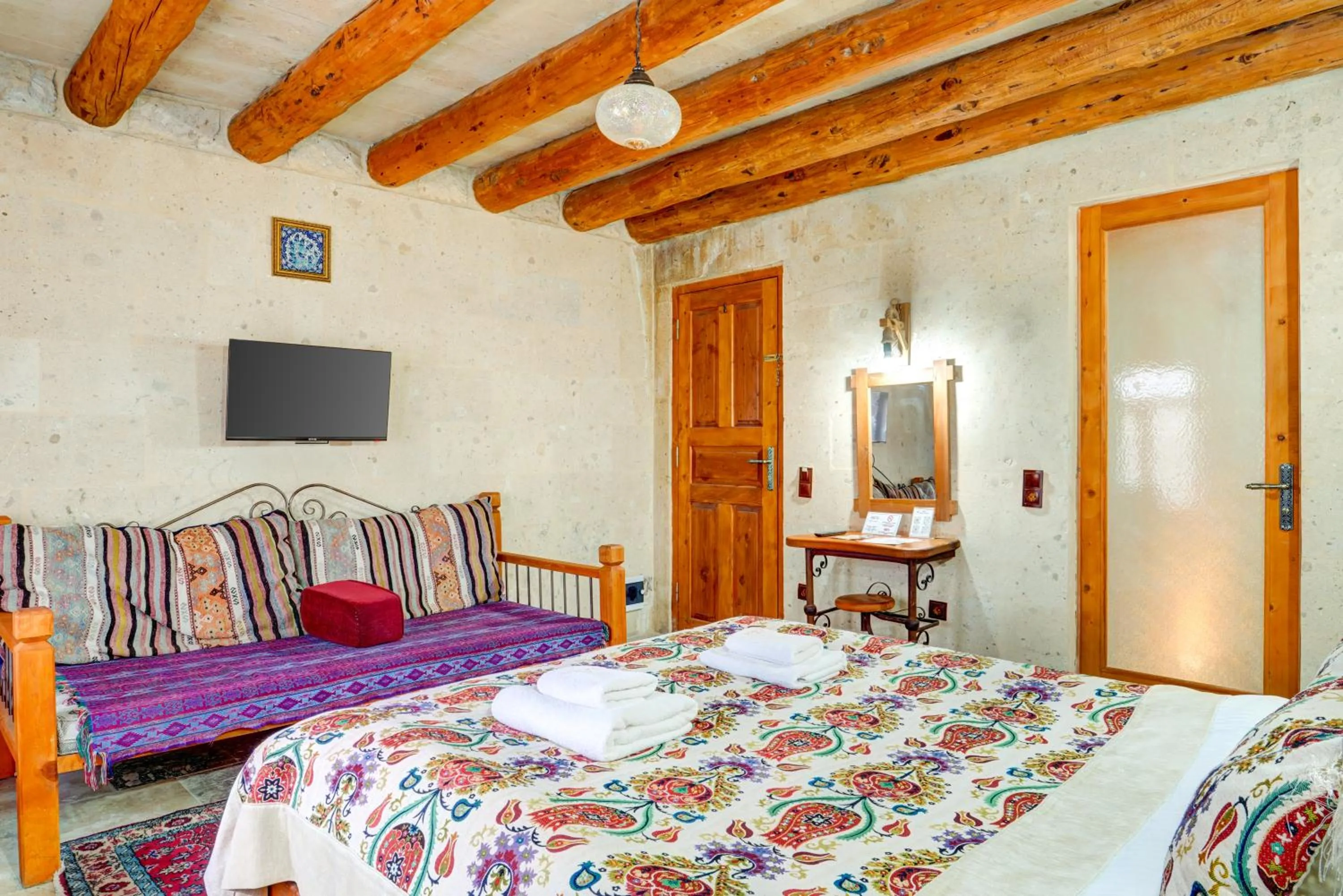 Bed in Atax Cave House