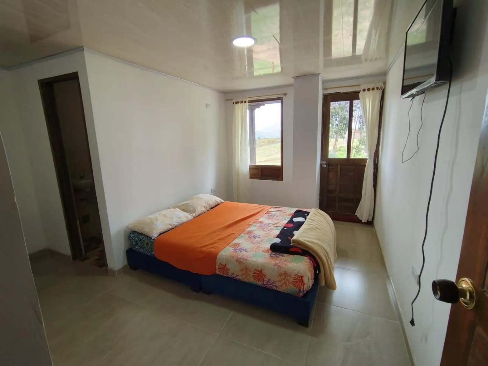 Bed in HOTEL TOTA ELISEO PLAYA BLANCA LAGO DE TOTA