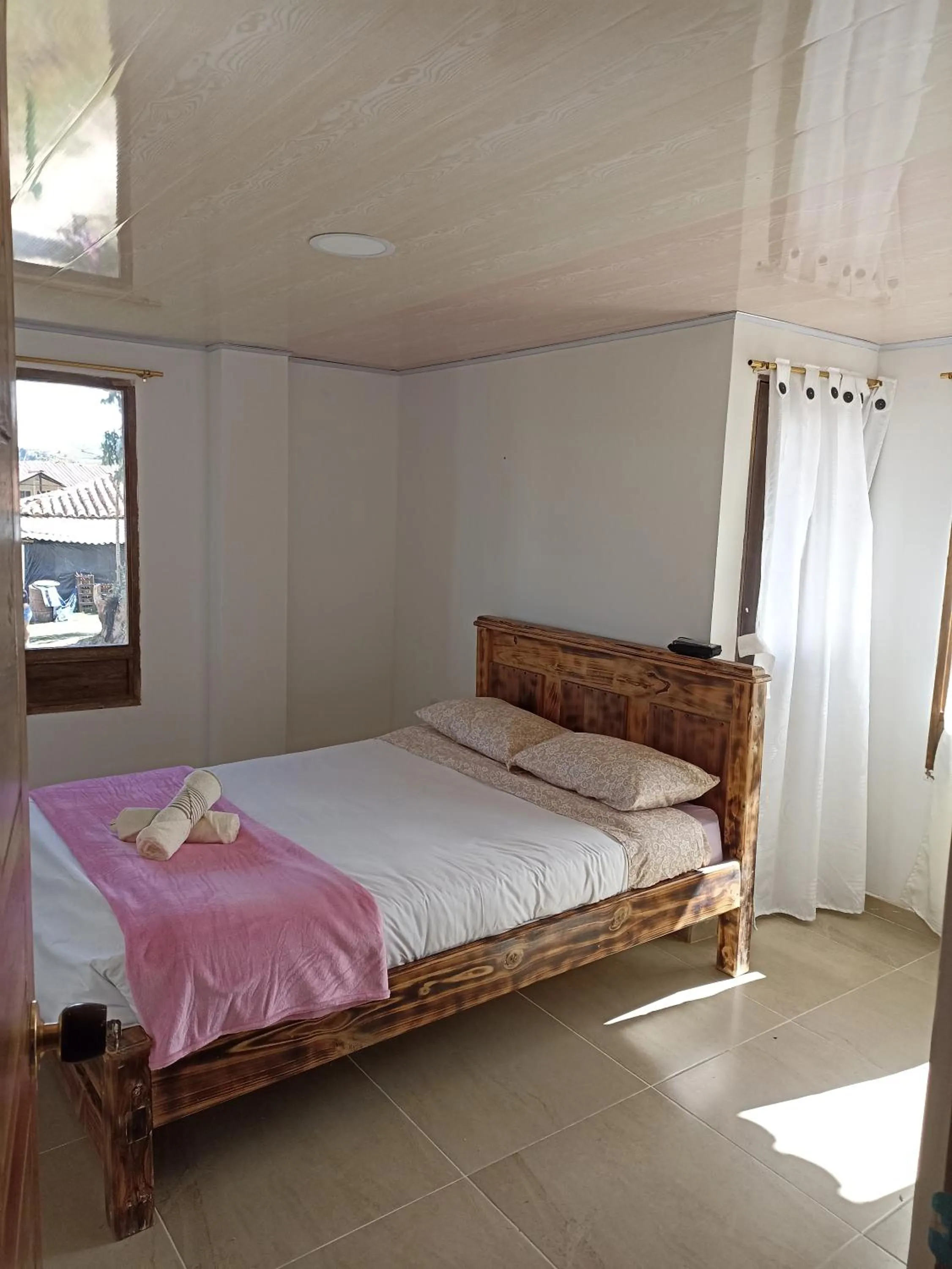 Bed in HOTEL TOTA ELISEO PLAYA BLANCA LAGO DE TOTA