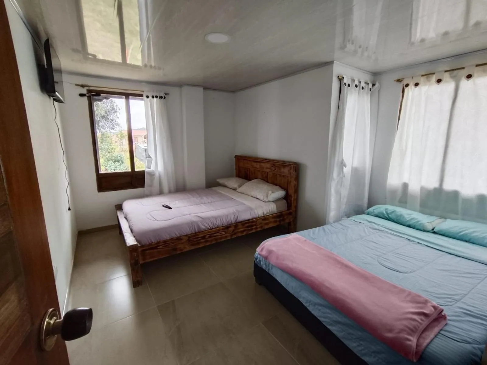 Bed in HOTEL TOTA ELISEO PLAYA BLANCA LAGO DE TOTA