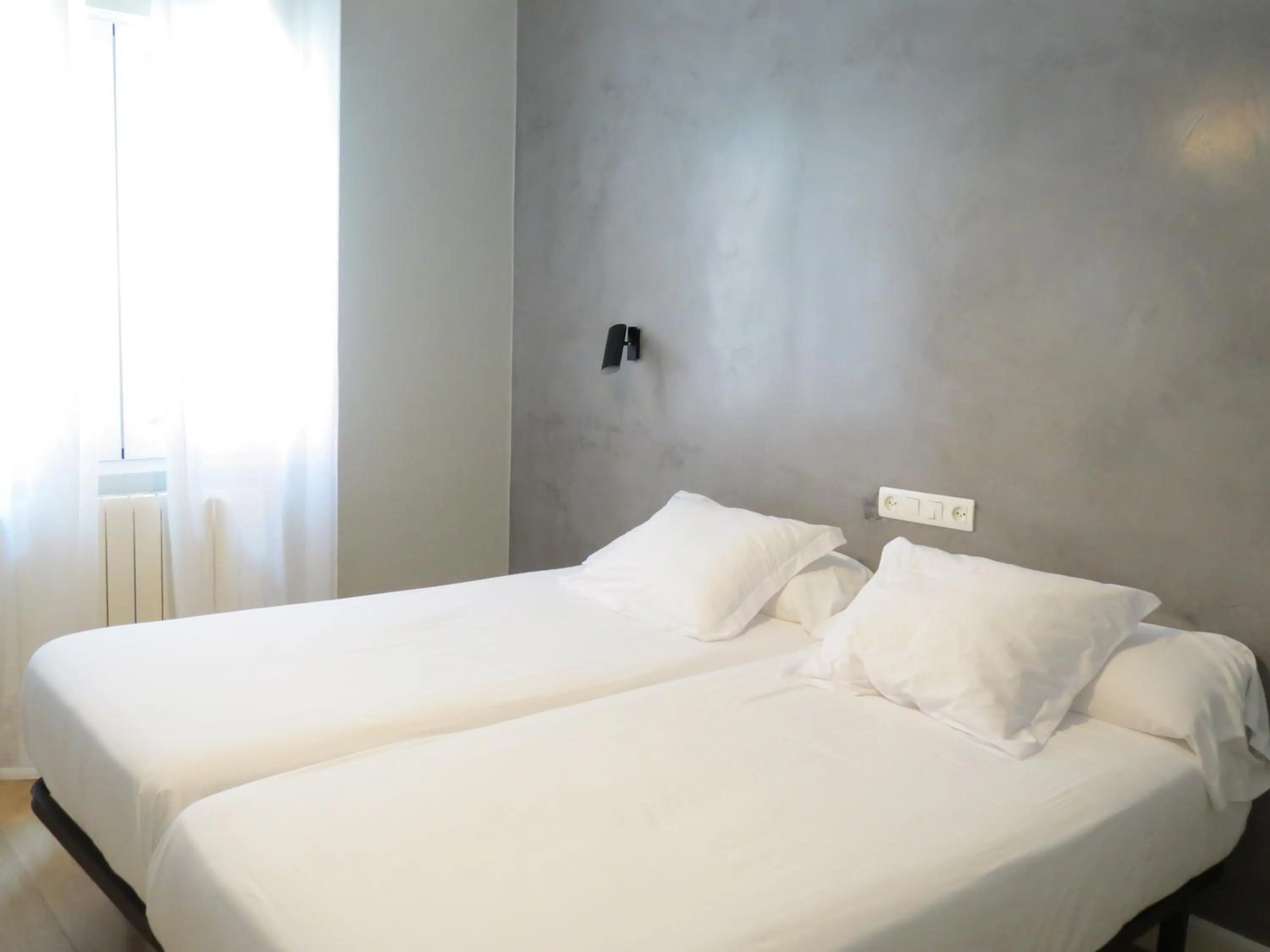 Bed in Pensión Don Claudio