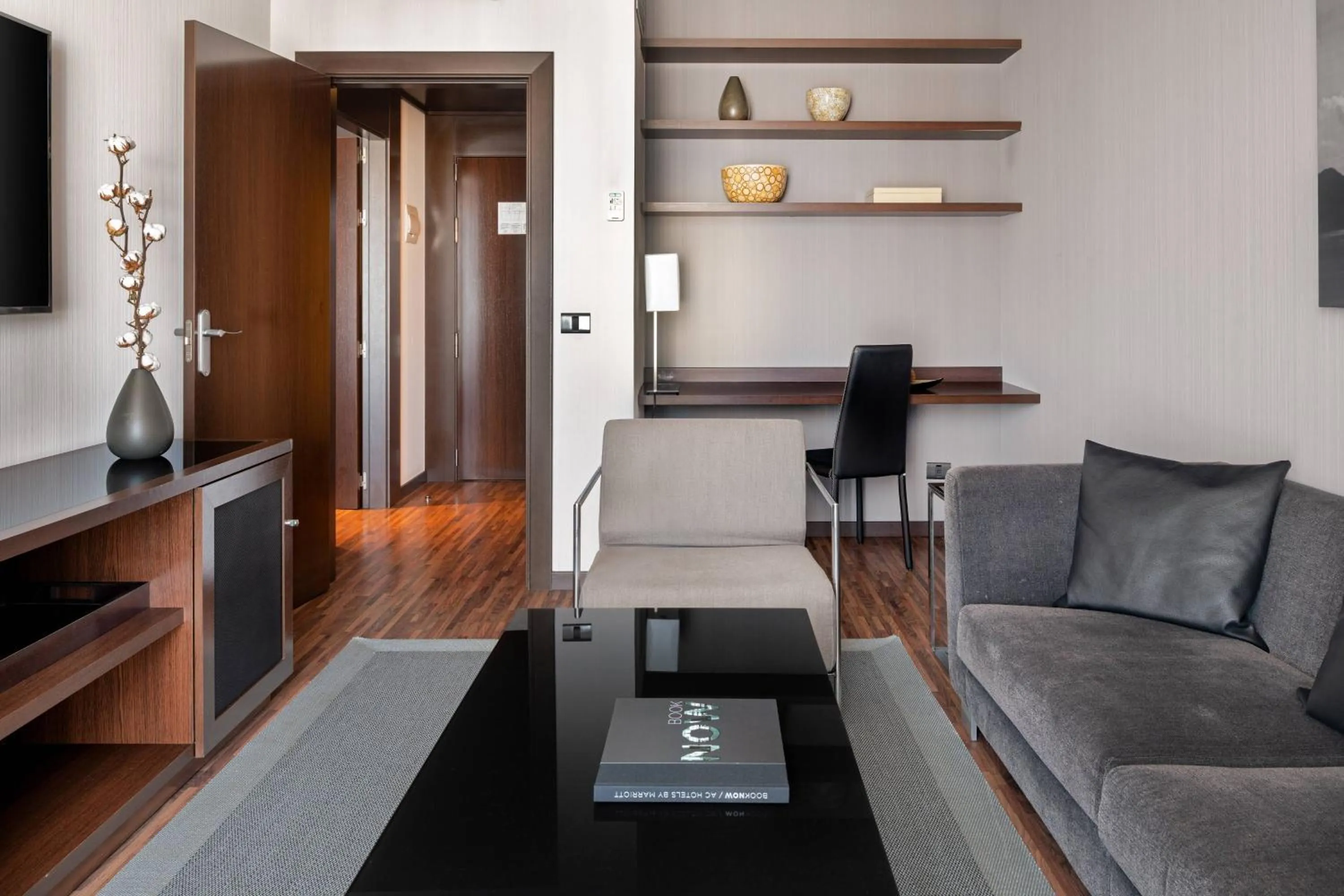 Living room in AC Hotel Palacio Universal by Marriott