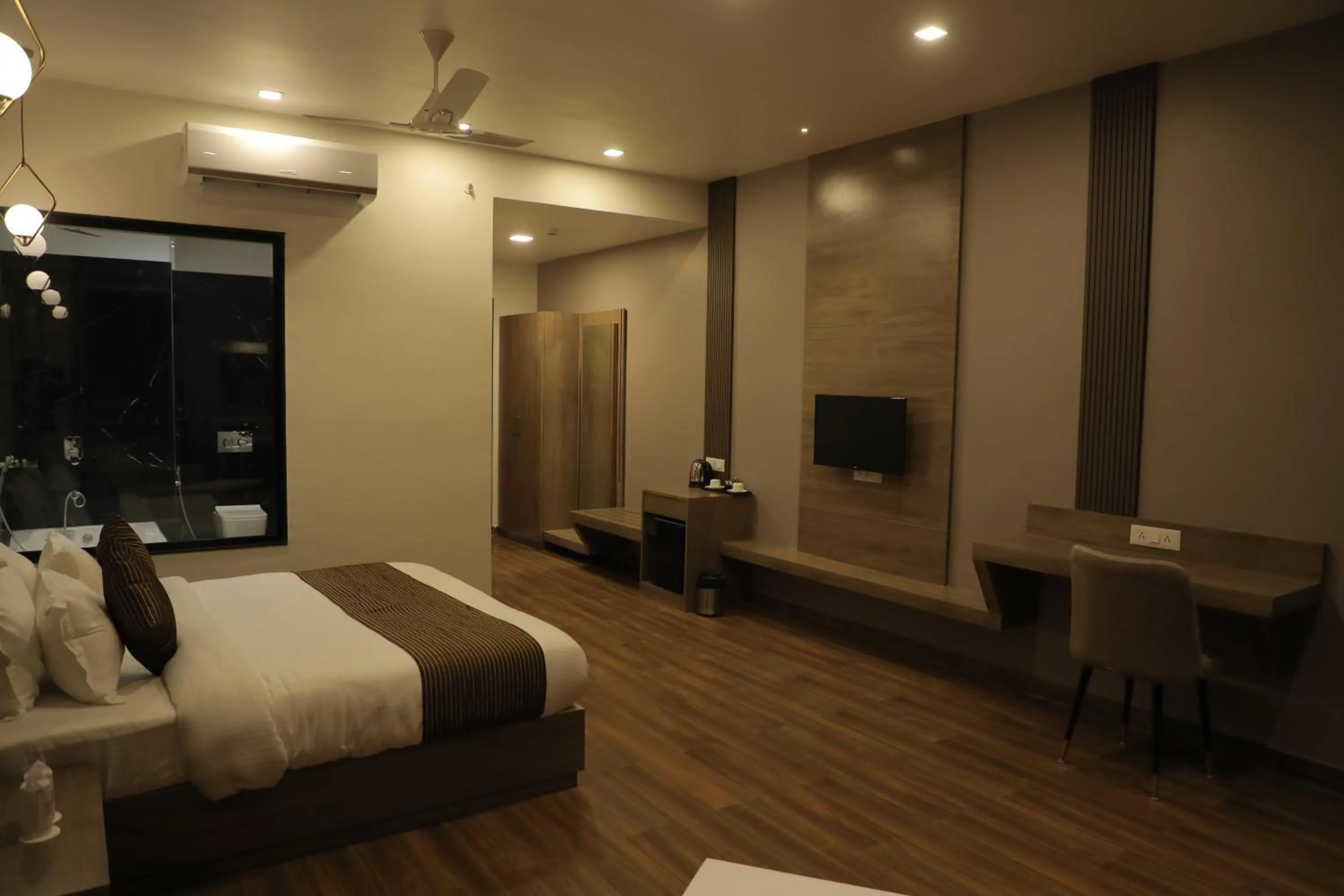 Communal lounge/ TV room, Bed in IMAGICA RESORTS