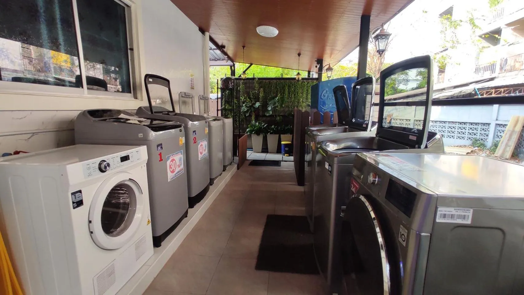 washing machine in 66 Apartment