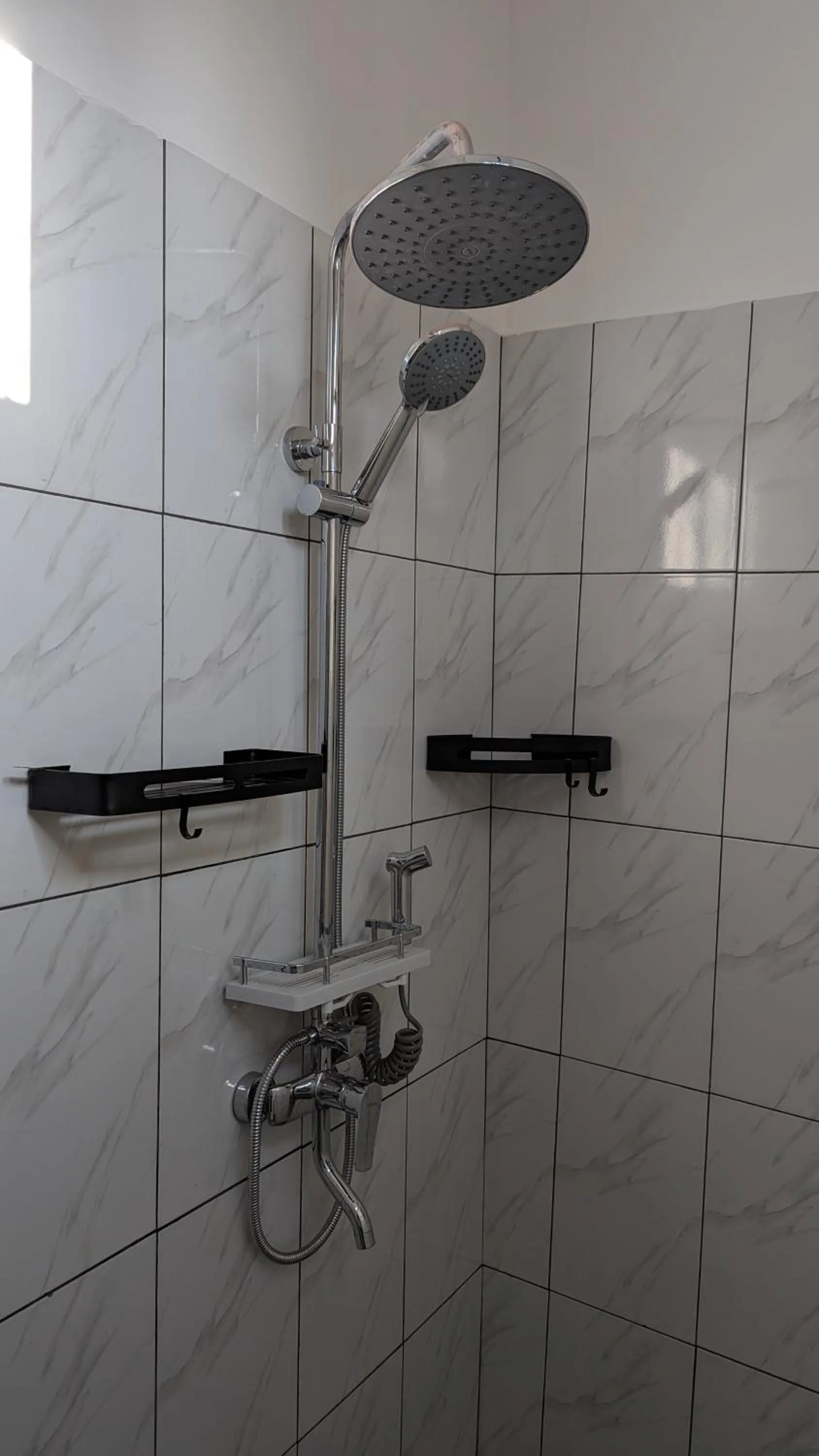 Shower in Mufasa city Hostel and Apartments