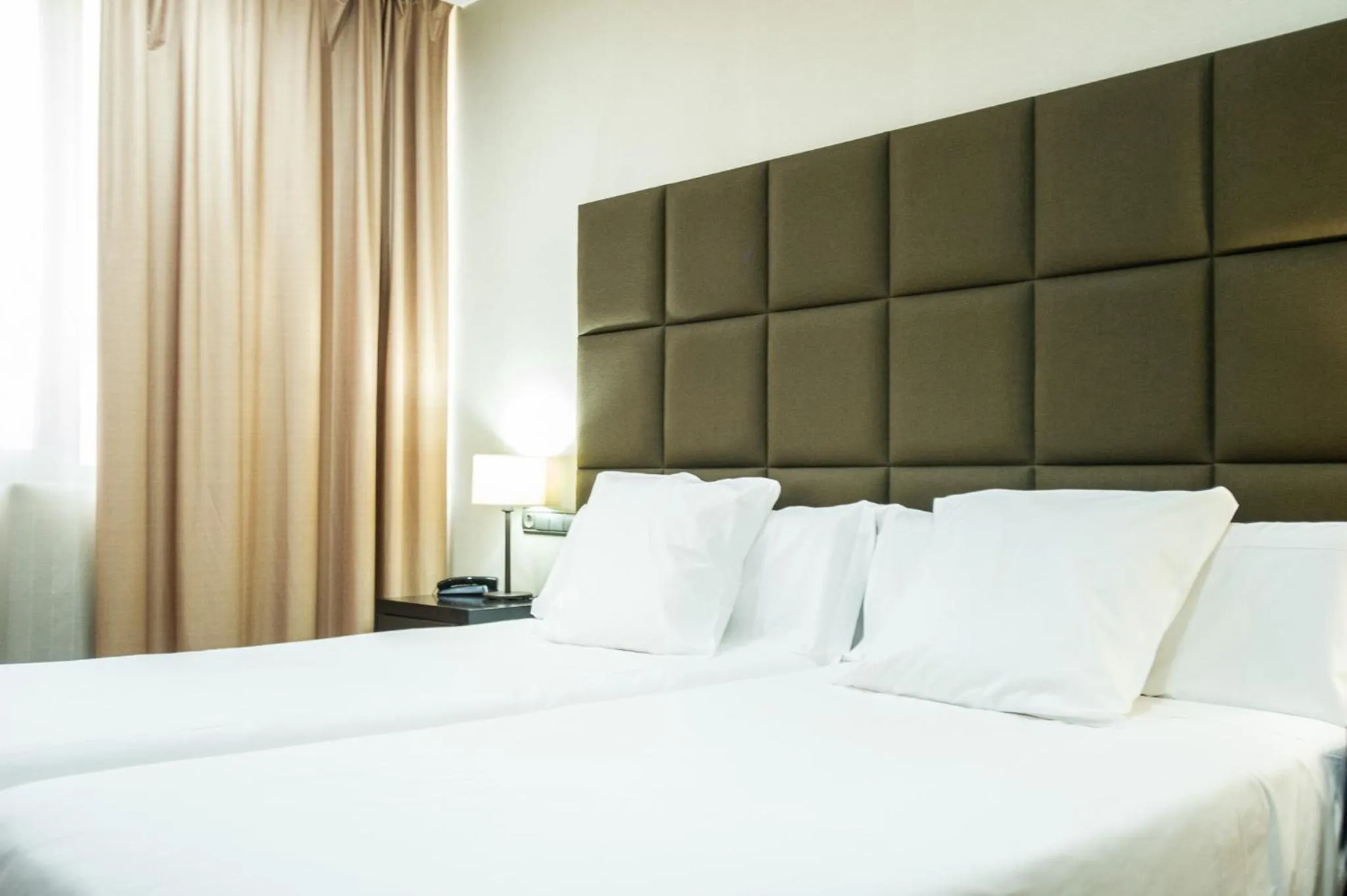 Bed in AZZ Asturias LangreHotel & Spa