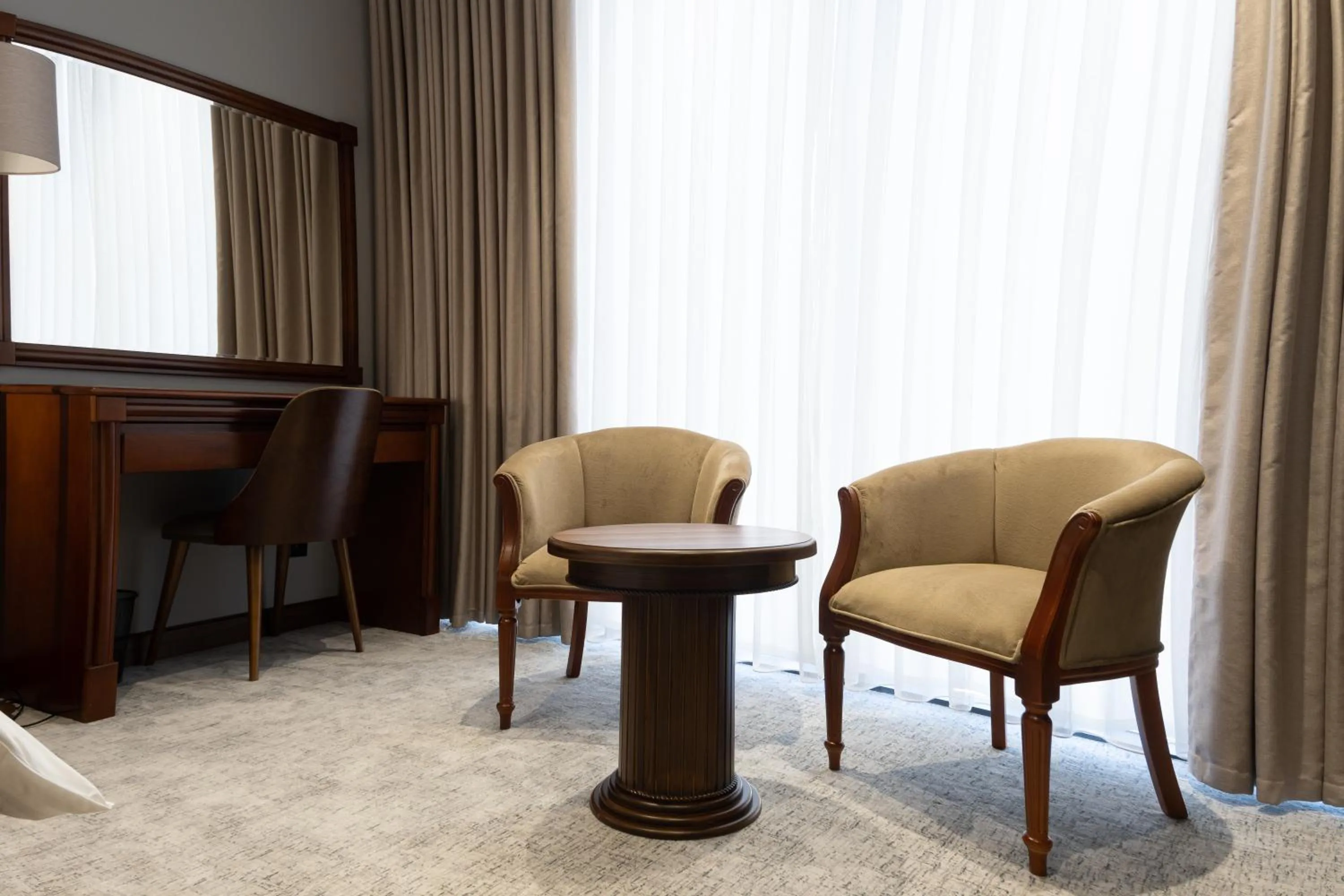 Seating area in Mir Luxe Plaza