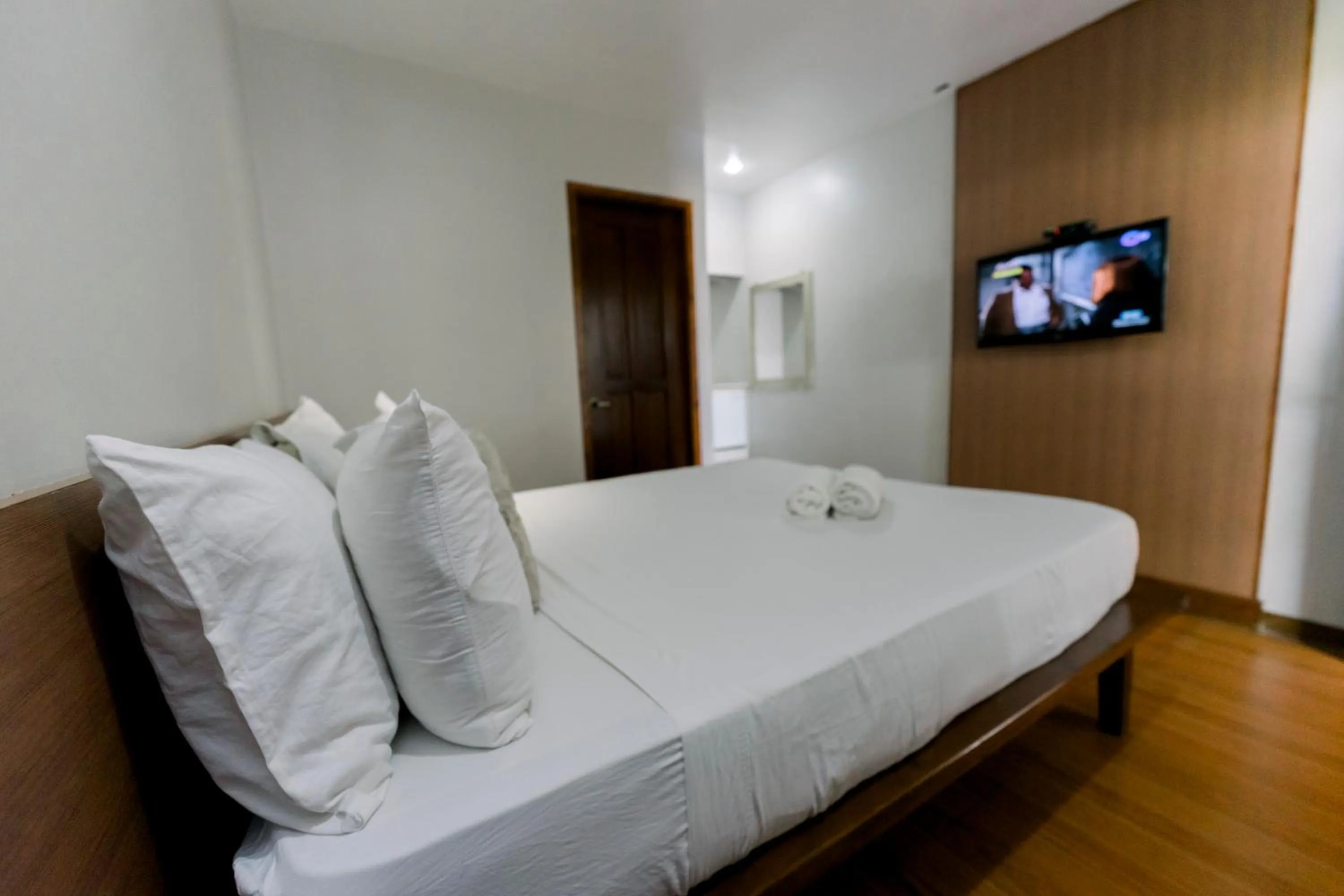 Bed in Madonna Hometel and Suites