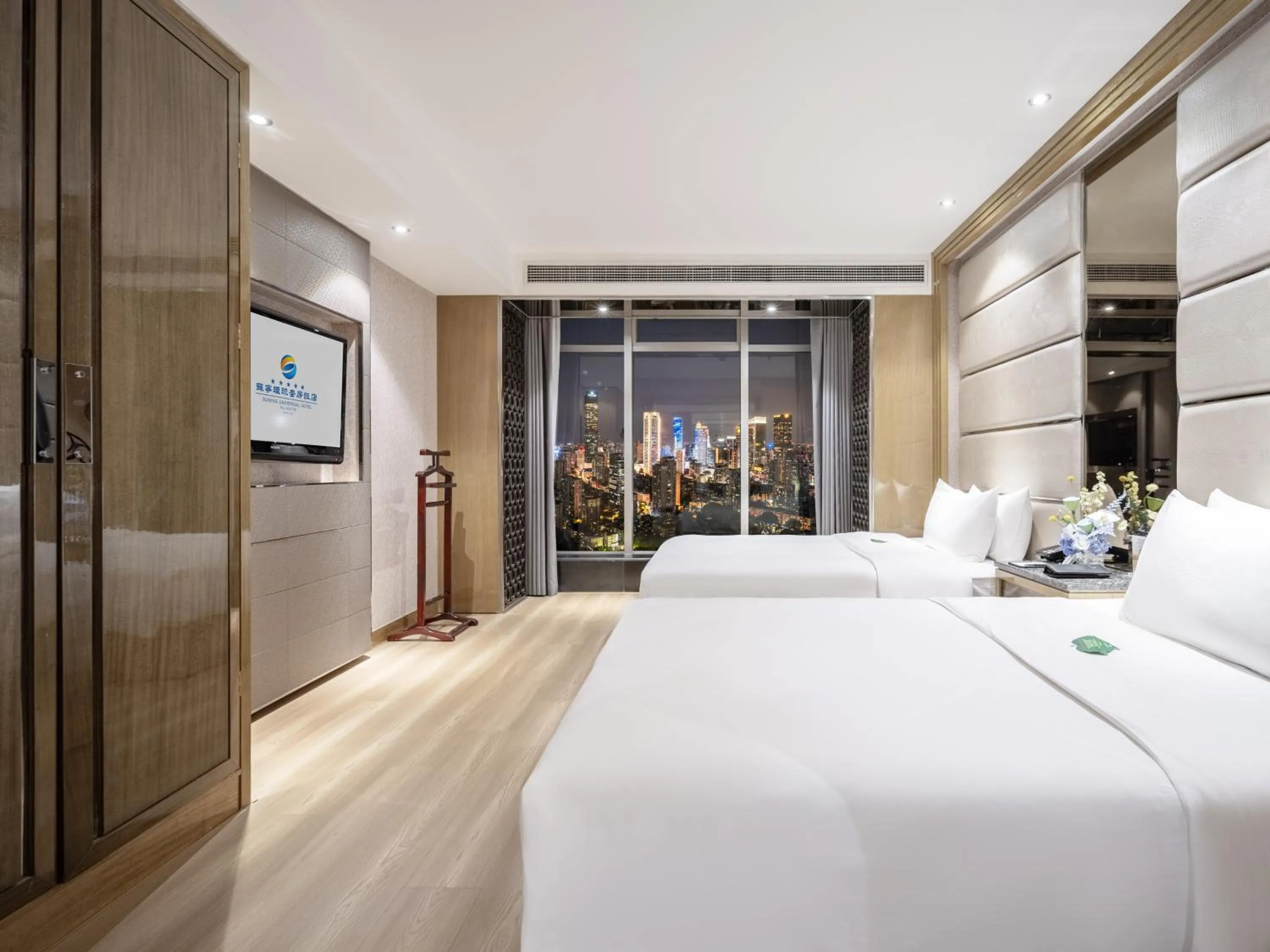 Bed in Suning Universal Hotel ALL-SUITES