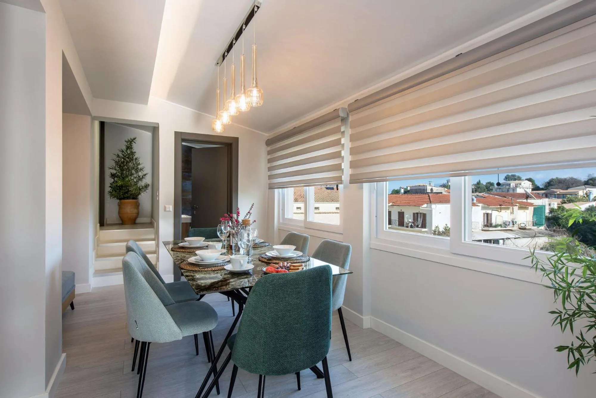 Dining area in Pelagia Apartment by Kormaris