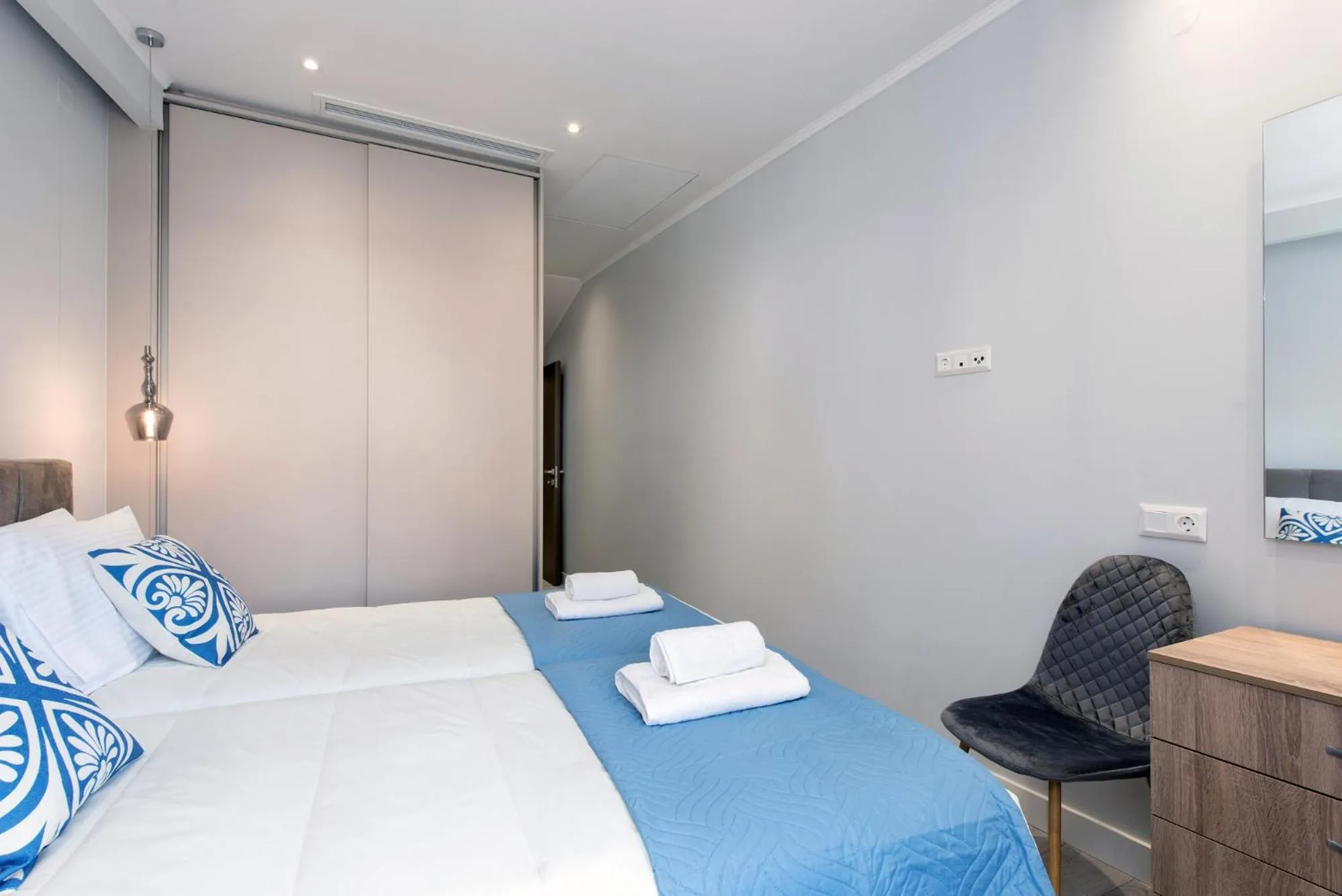 Bed in Pelagia Apartment by Kormaris