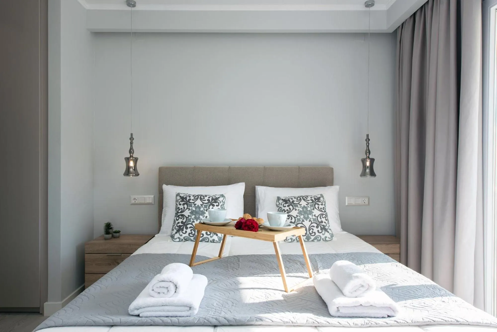 Bed in Pelagia Apartment by Kormaris