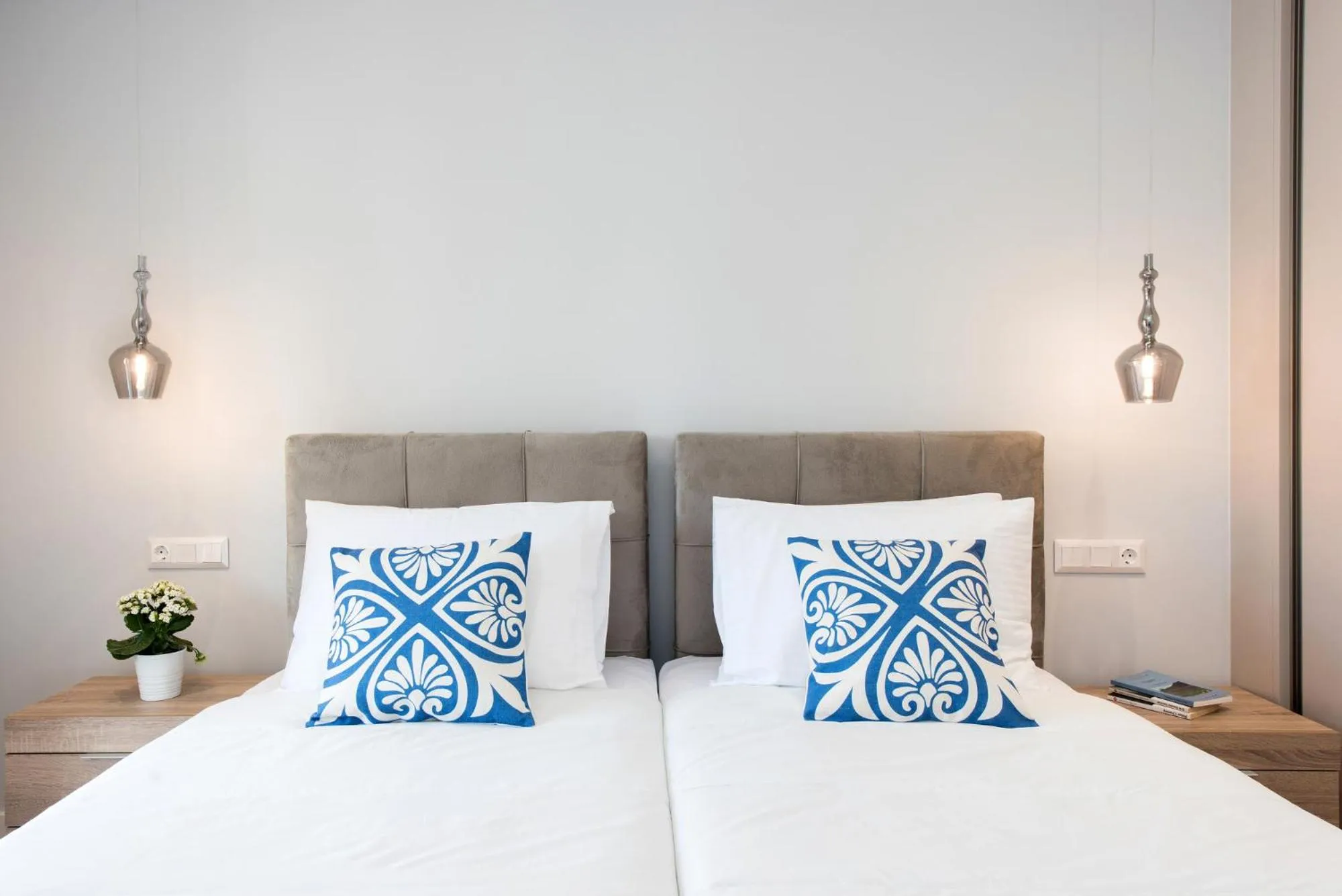 Bed in Pelagia Apartment by Kormaris