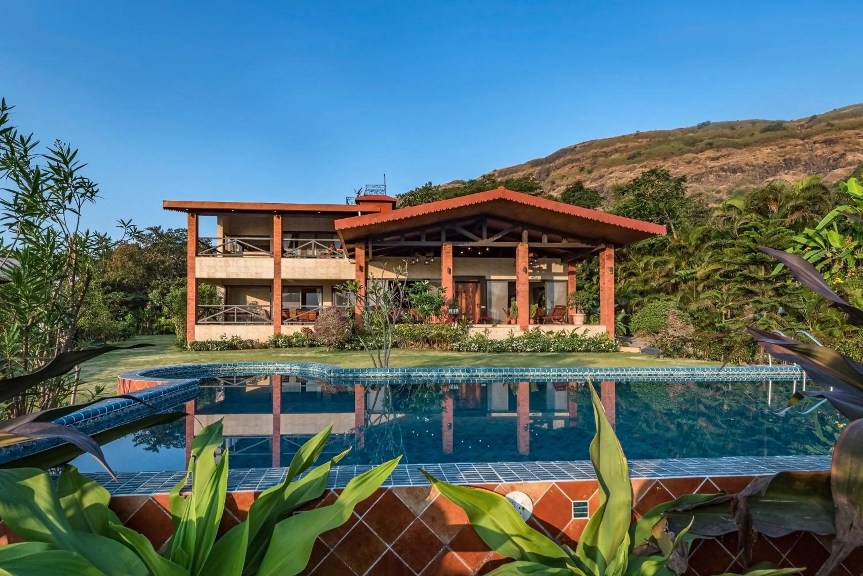 SaffronStays Althea - 4BR veg-only luxury villa with pool, jacuzzis, gourmet meals and Lohagad-Pawna lake views