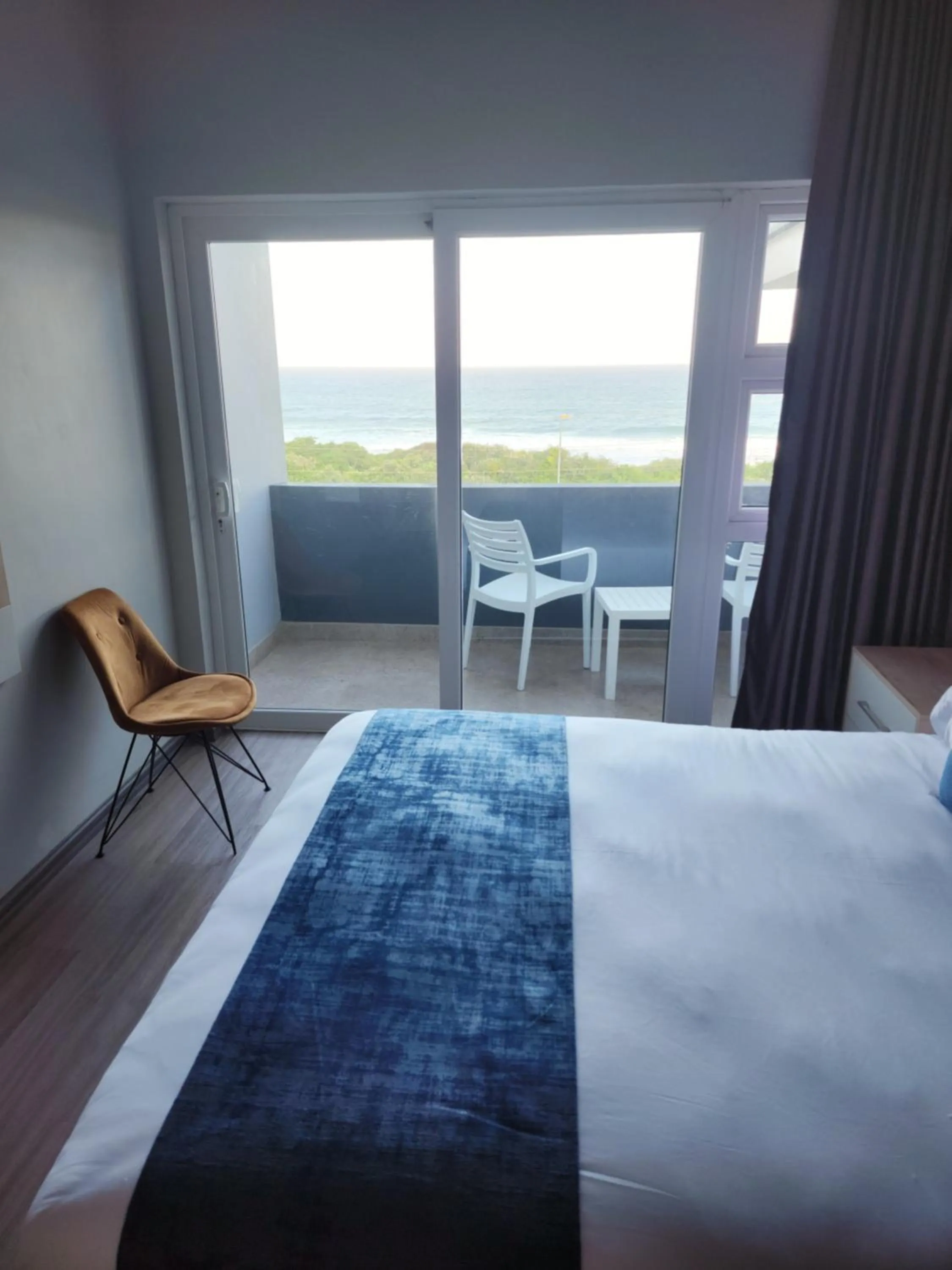 Seating area, Bed in 12 Oceans Hotel and Conference Centre