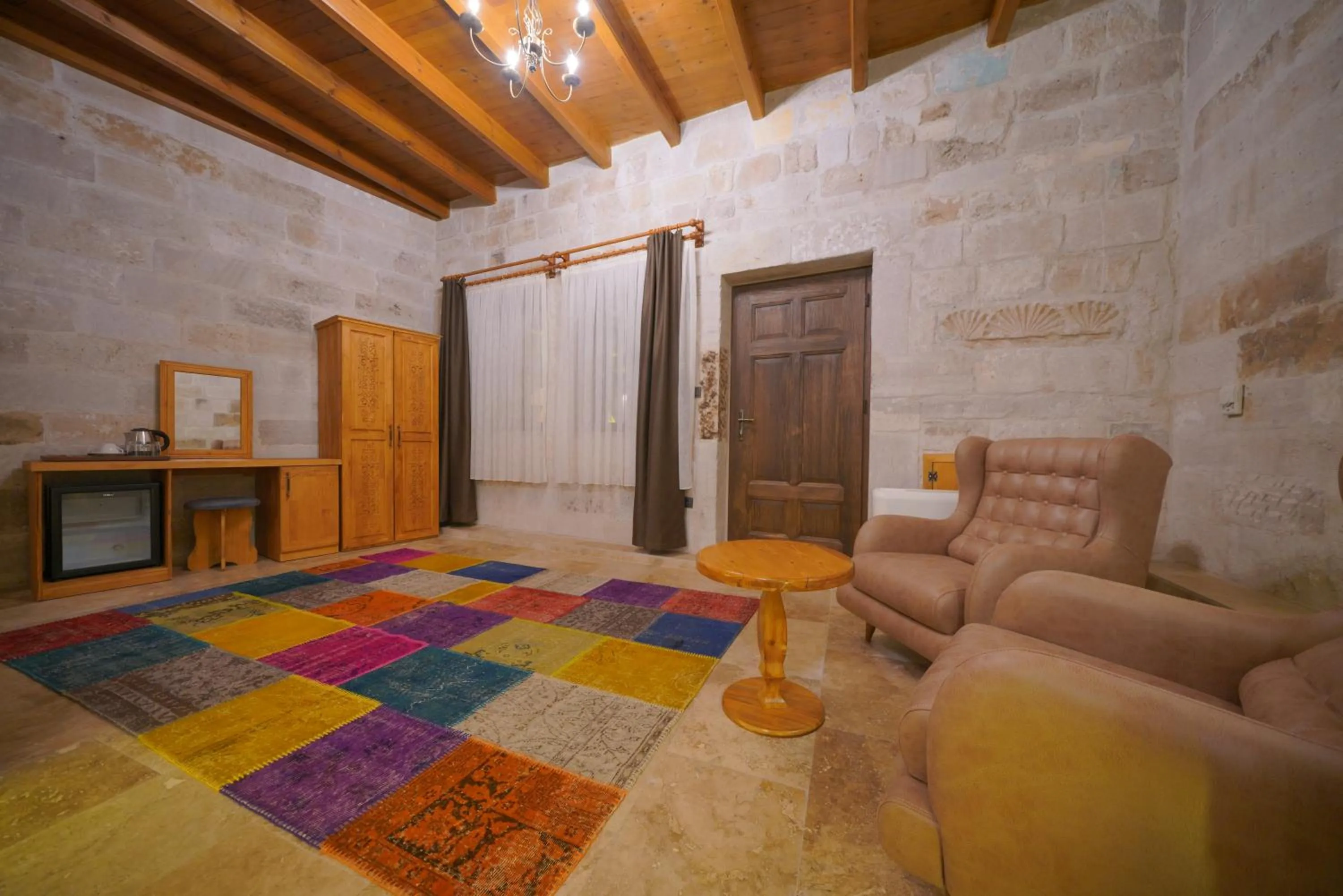 Living room, Bed in Cappadocia Secret Hill Cave Suites