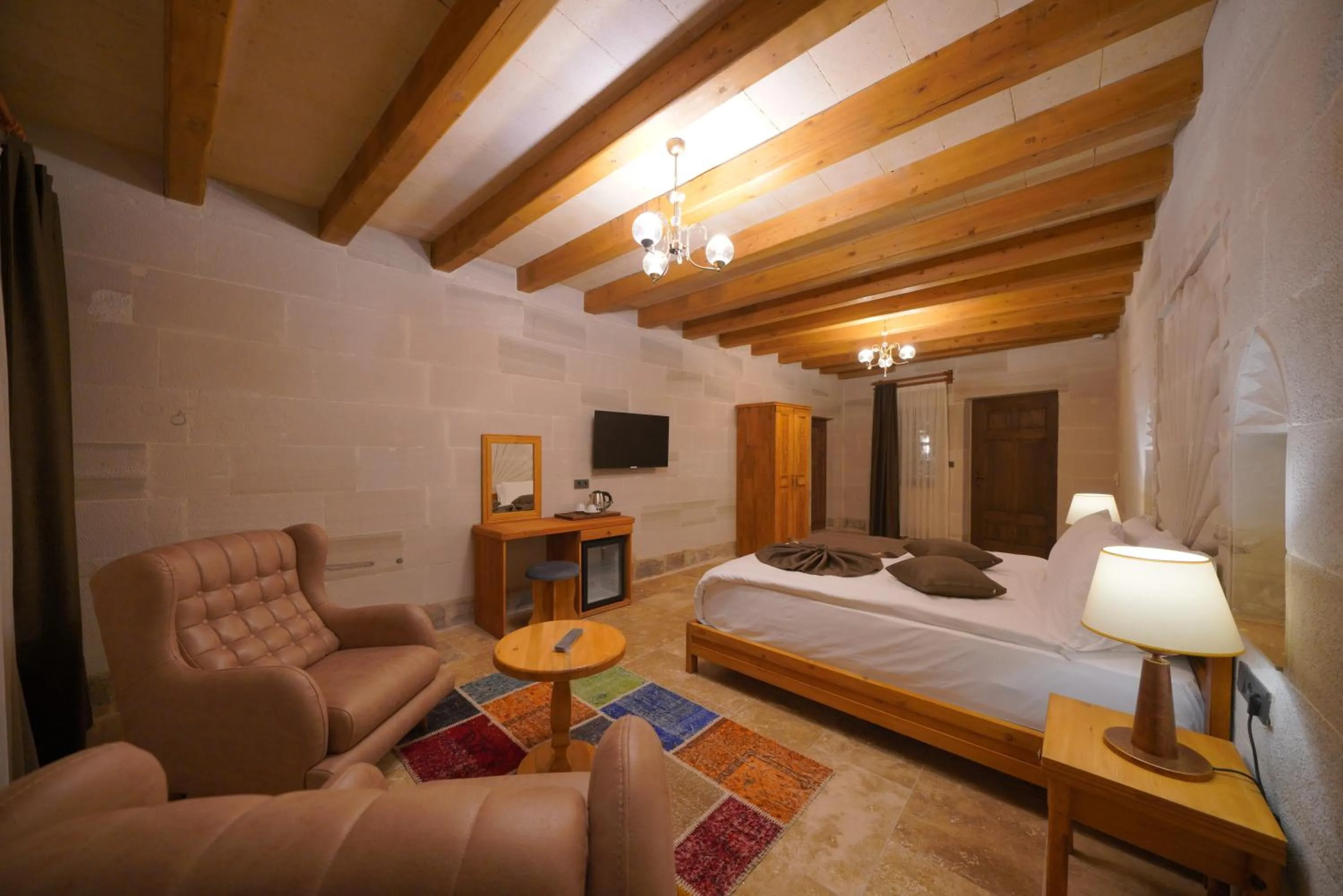 Communal lounge/ TV room, Bed in Cappadocia Secret Hill Cave Suites