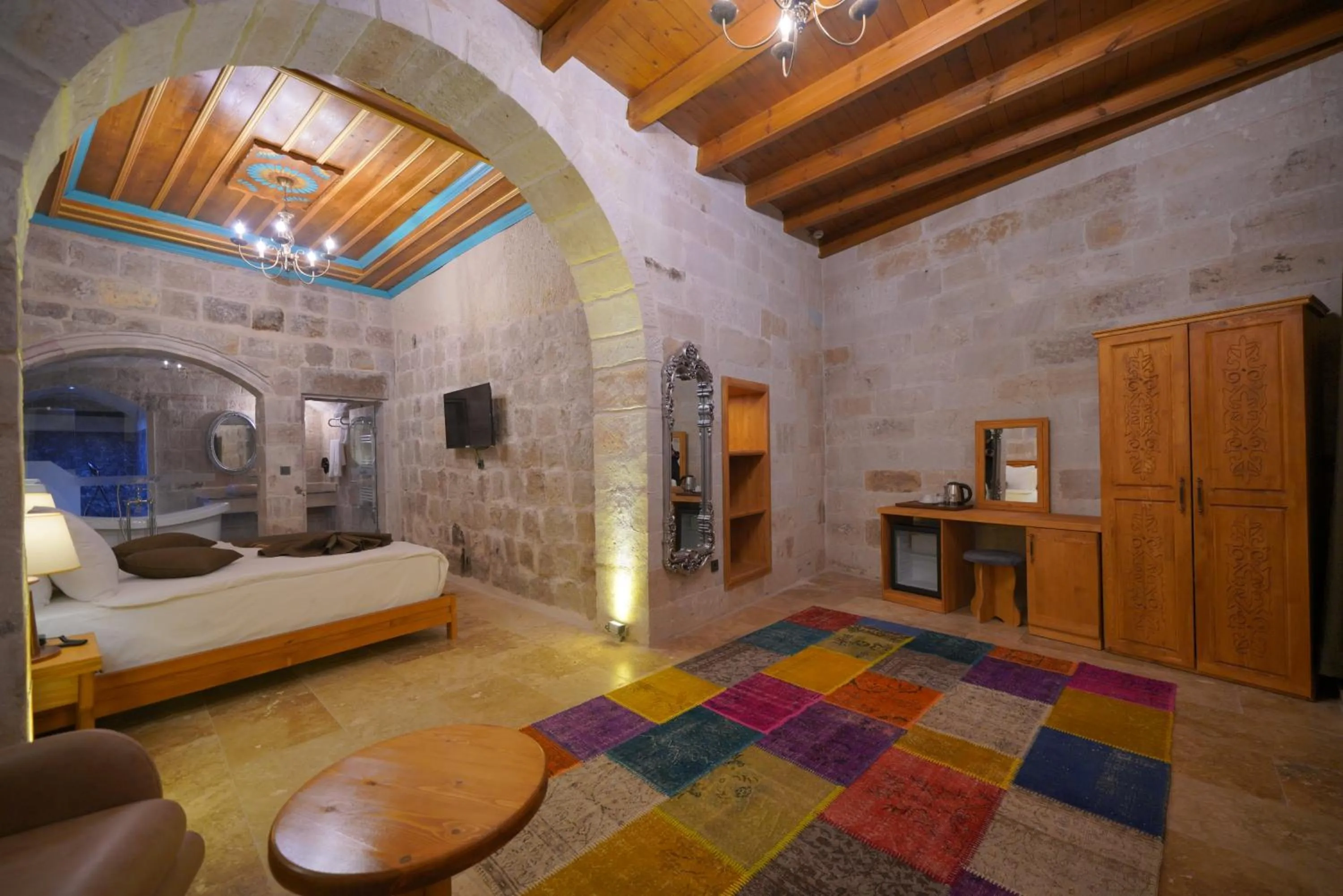 Communal lounge/ TV room, Bed in Cappadocia Secret Hill Cave Suites