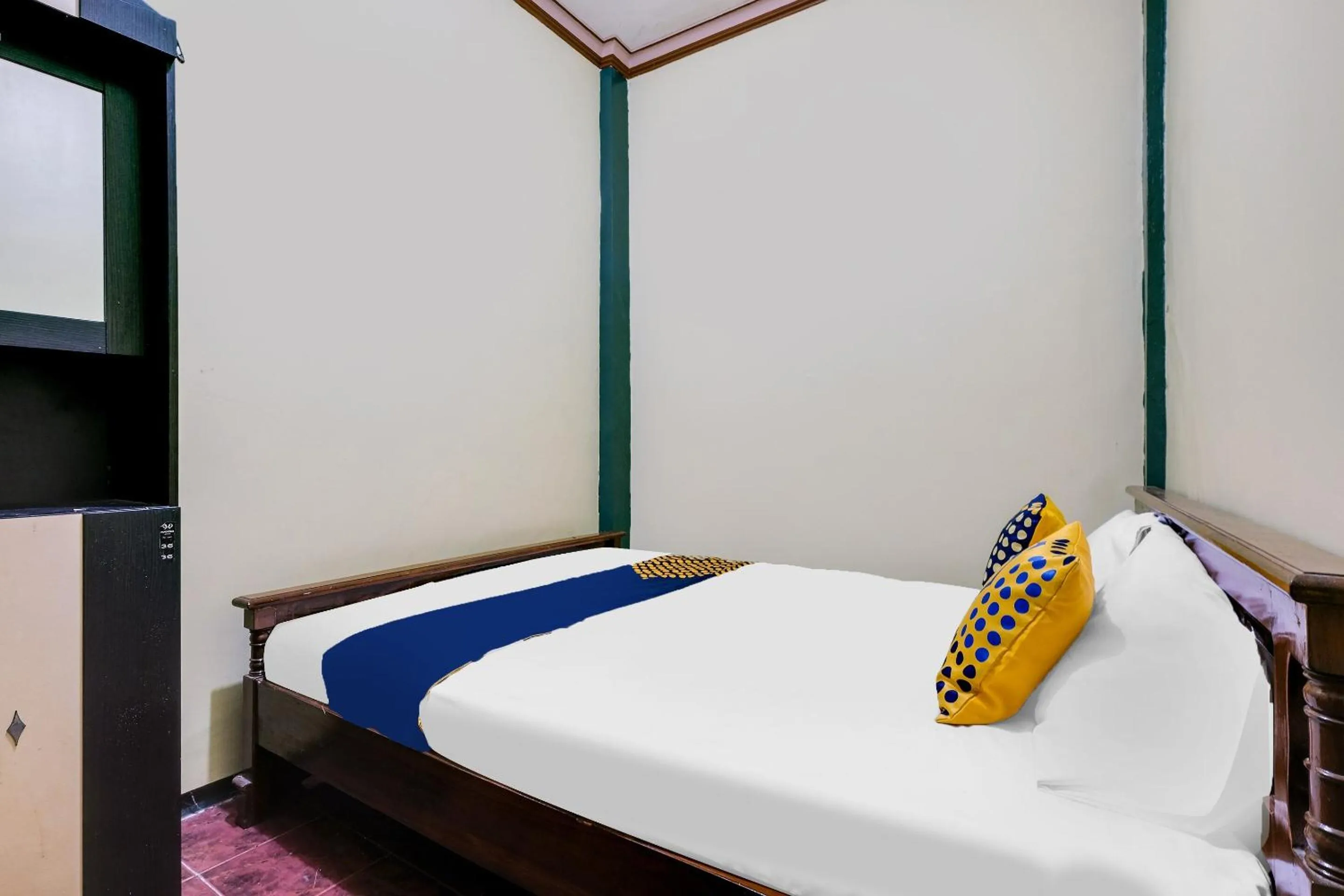 Bedroom in SPOT ON 92068 Pudja Kesuma Homestay Syariah Yogyakarta