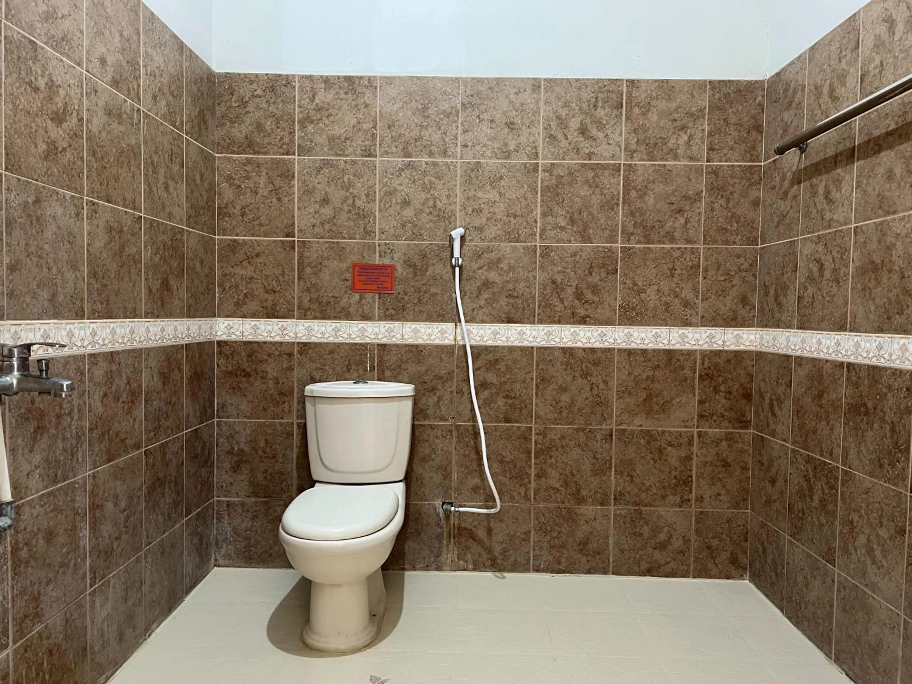 Bathroom in Hotel O Kost Orange Syariah