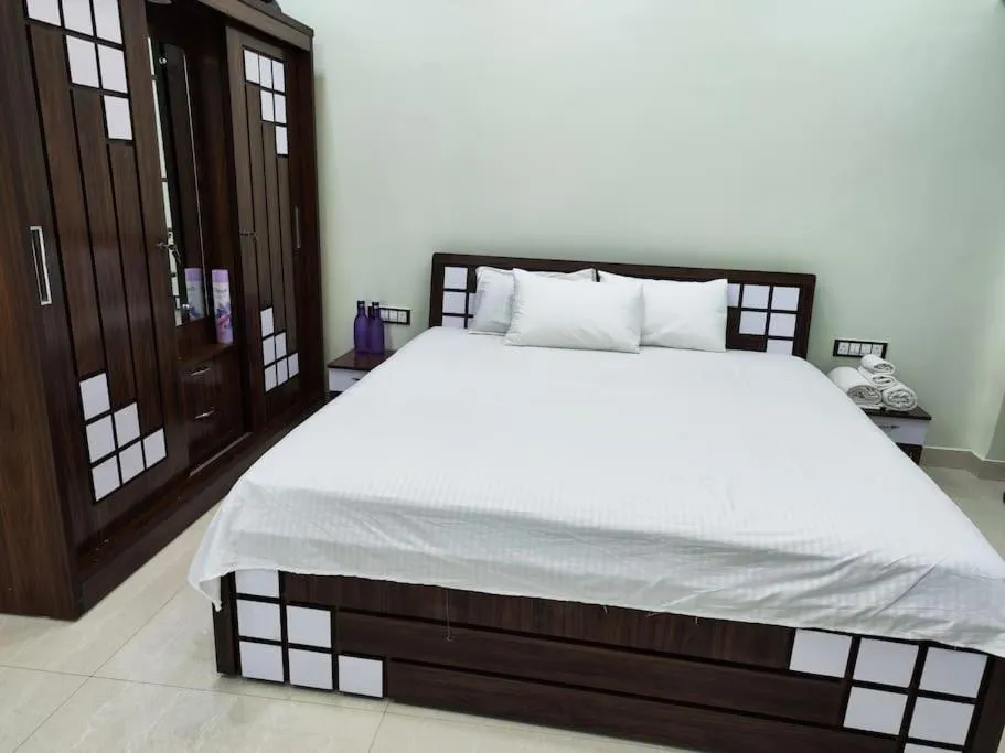 Bed in 1BHK AC Service Apartment 202