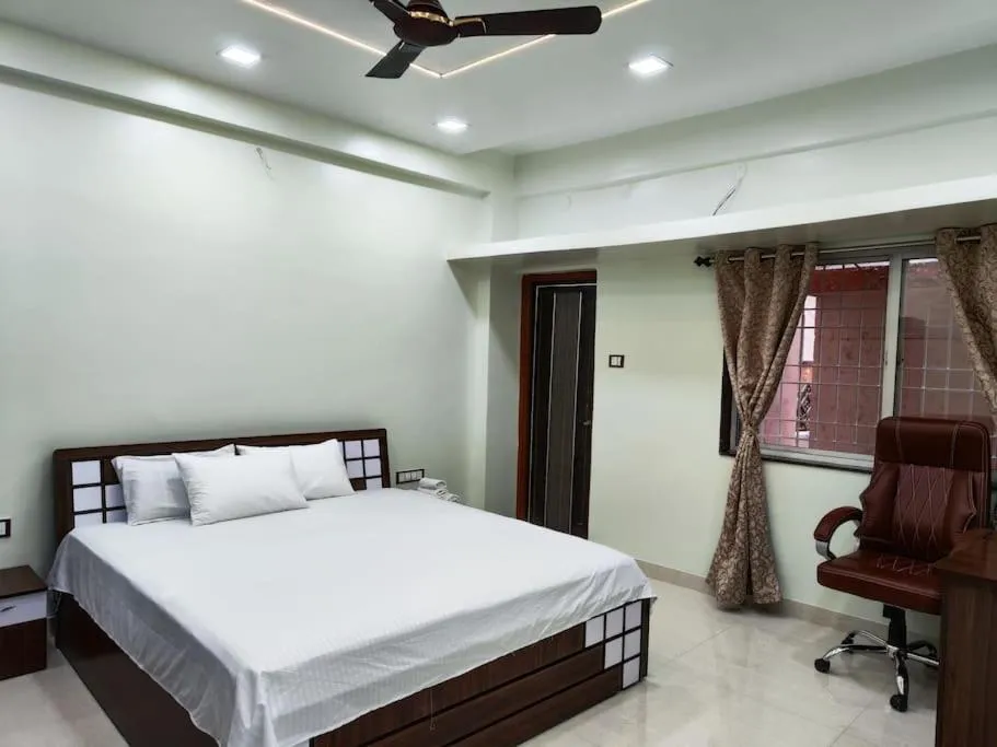 Bed in 1BHK AC Service Apartment 202