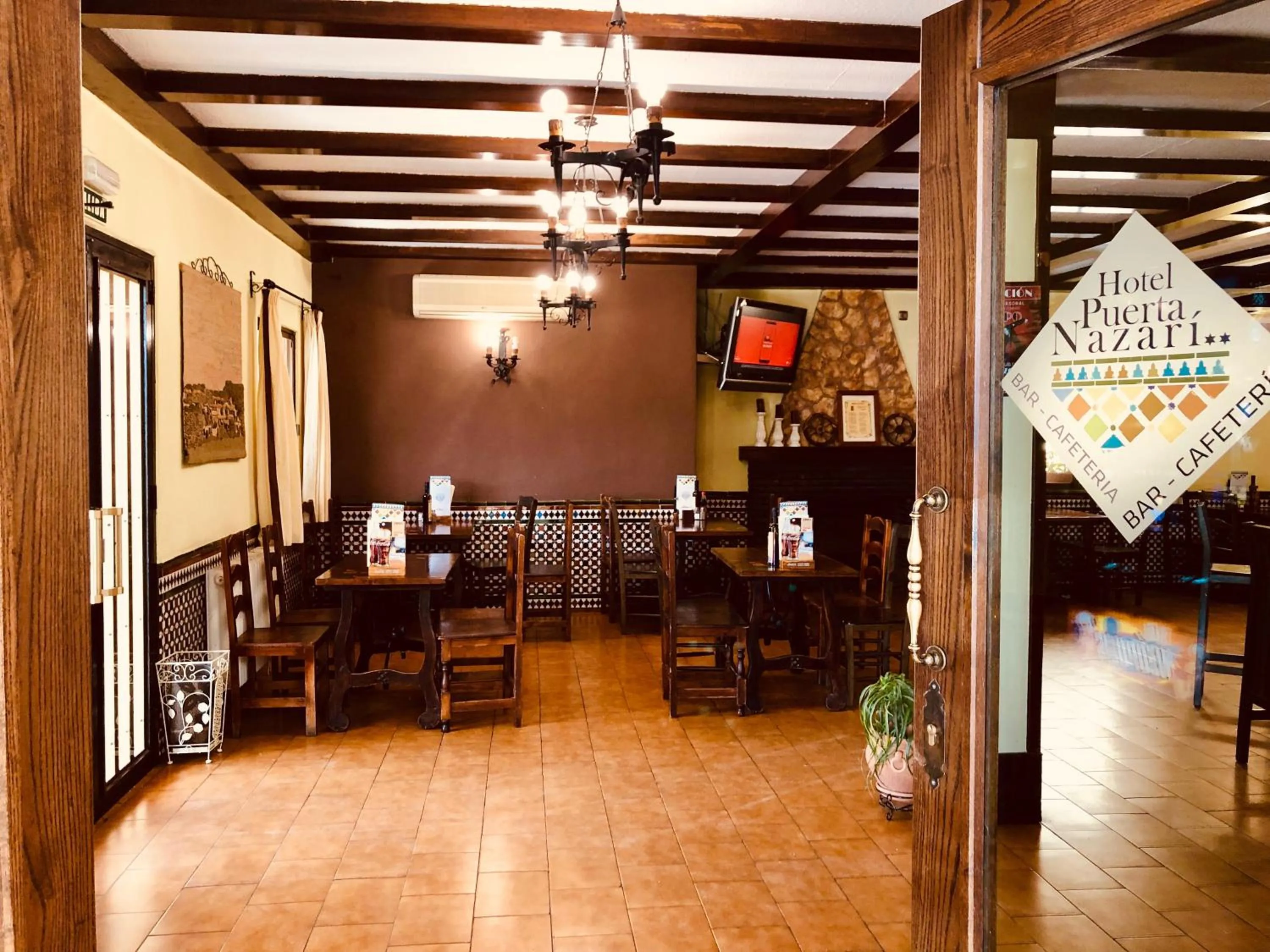 Property logo or sign in Hotel Puerta Nazarí