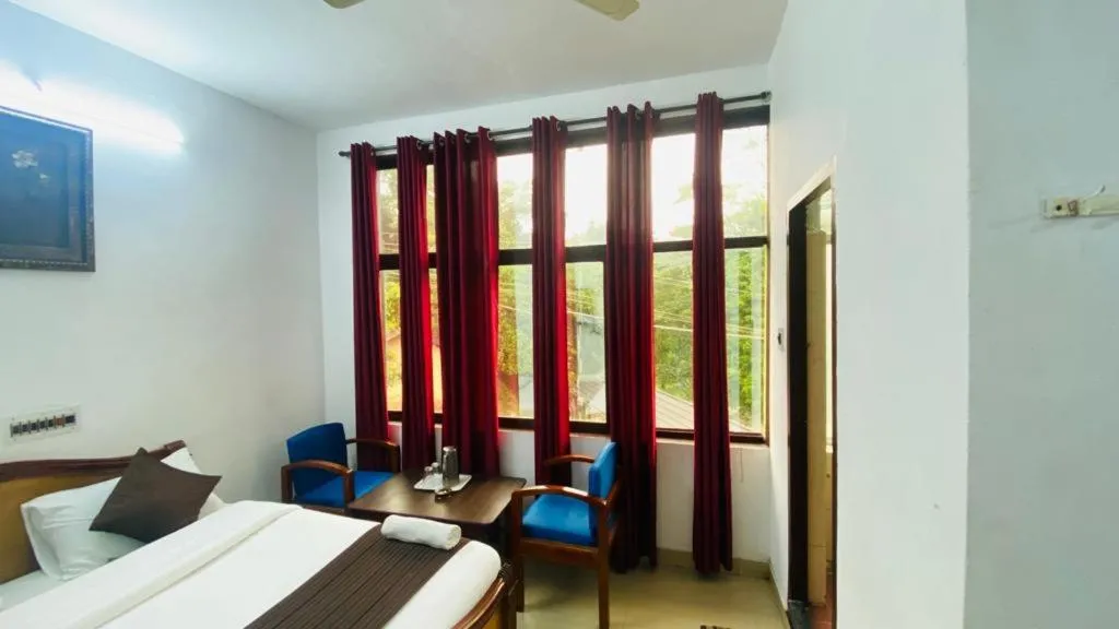Bed in Hotel Caveri Inn