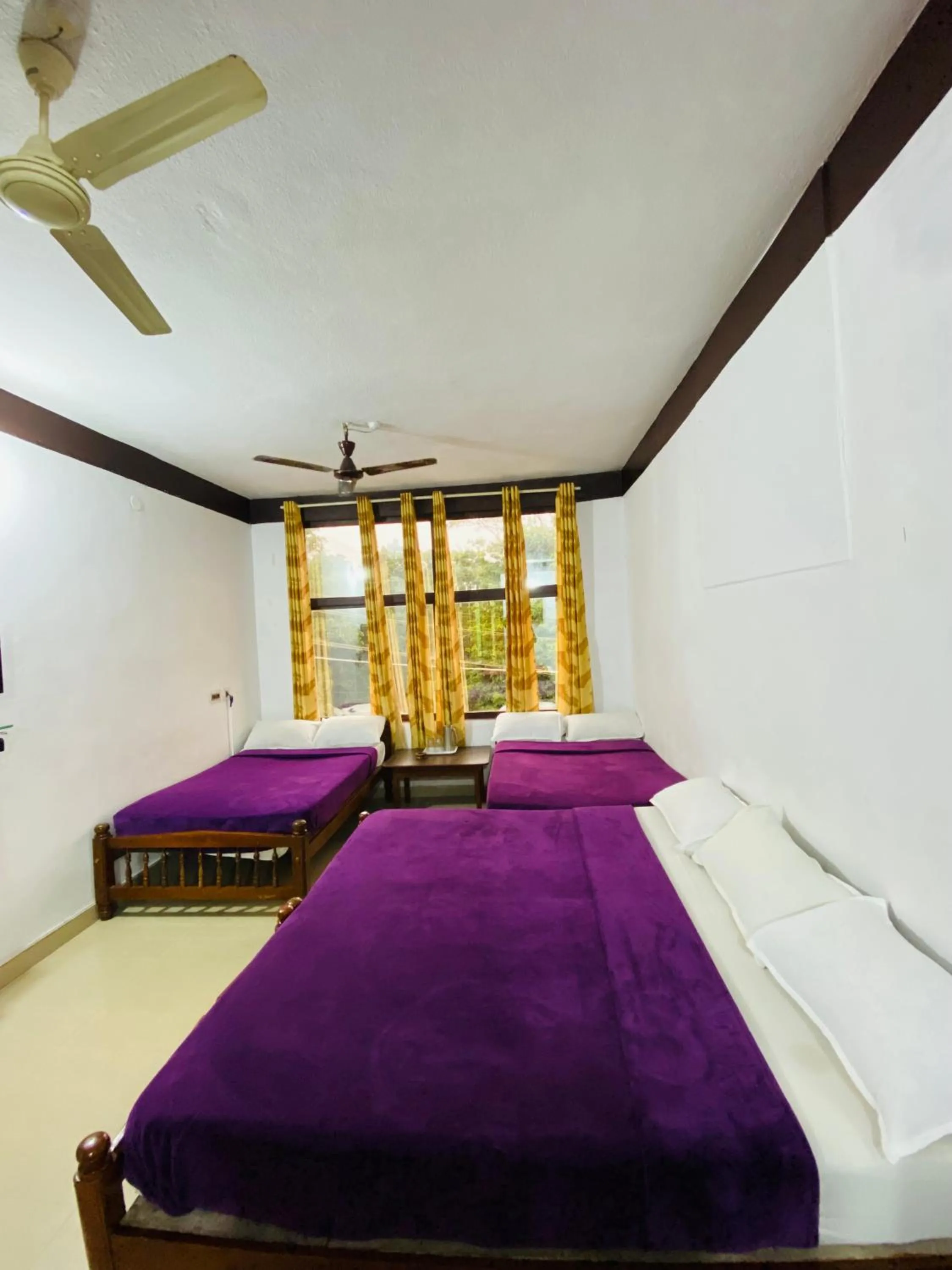 Bed in Hotel Caveri Inn