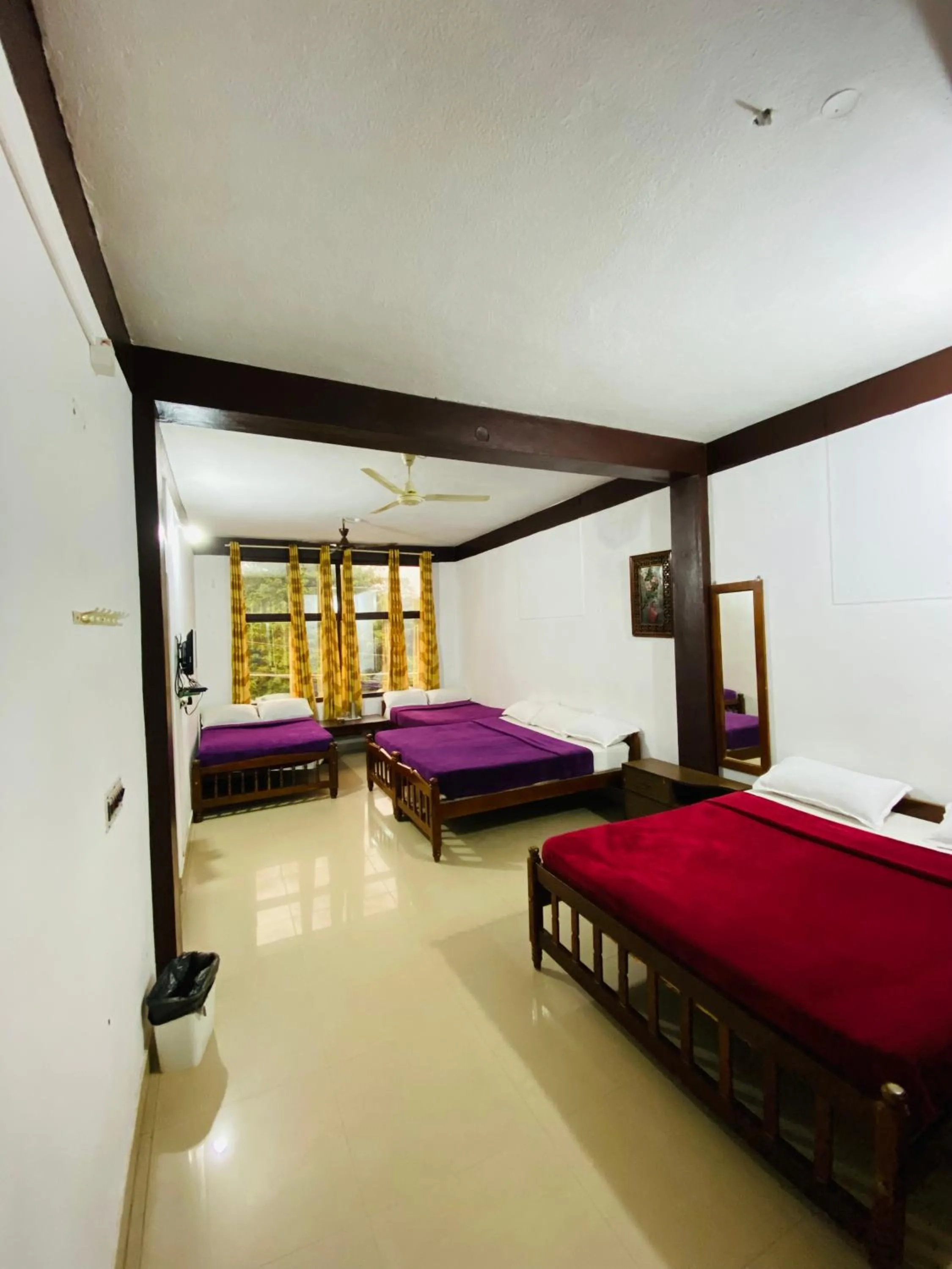 Bed in Hotel Caveri Inn