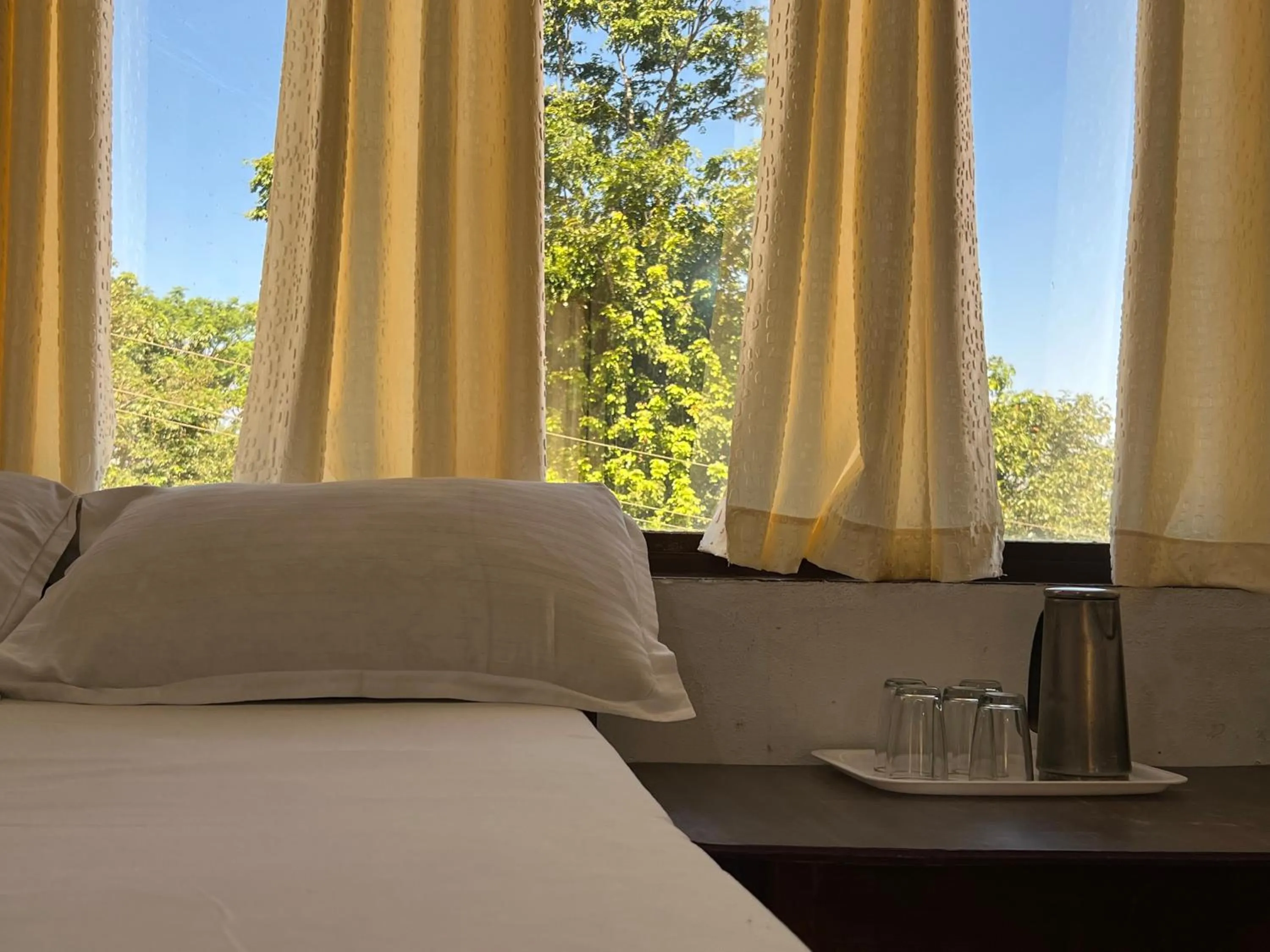 Bed in Hotel Caveri Inn