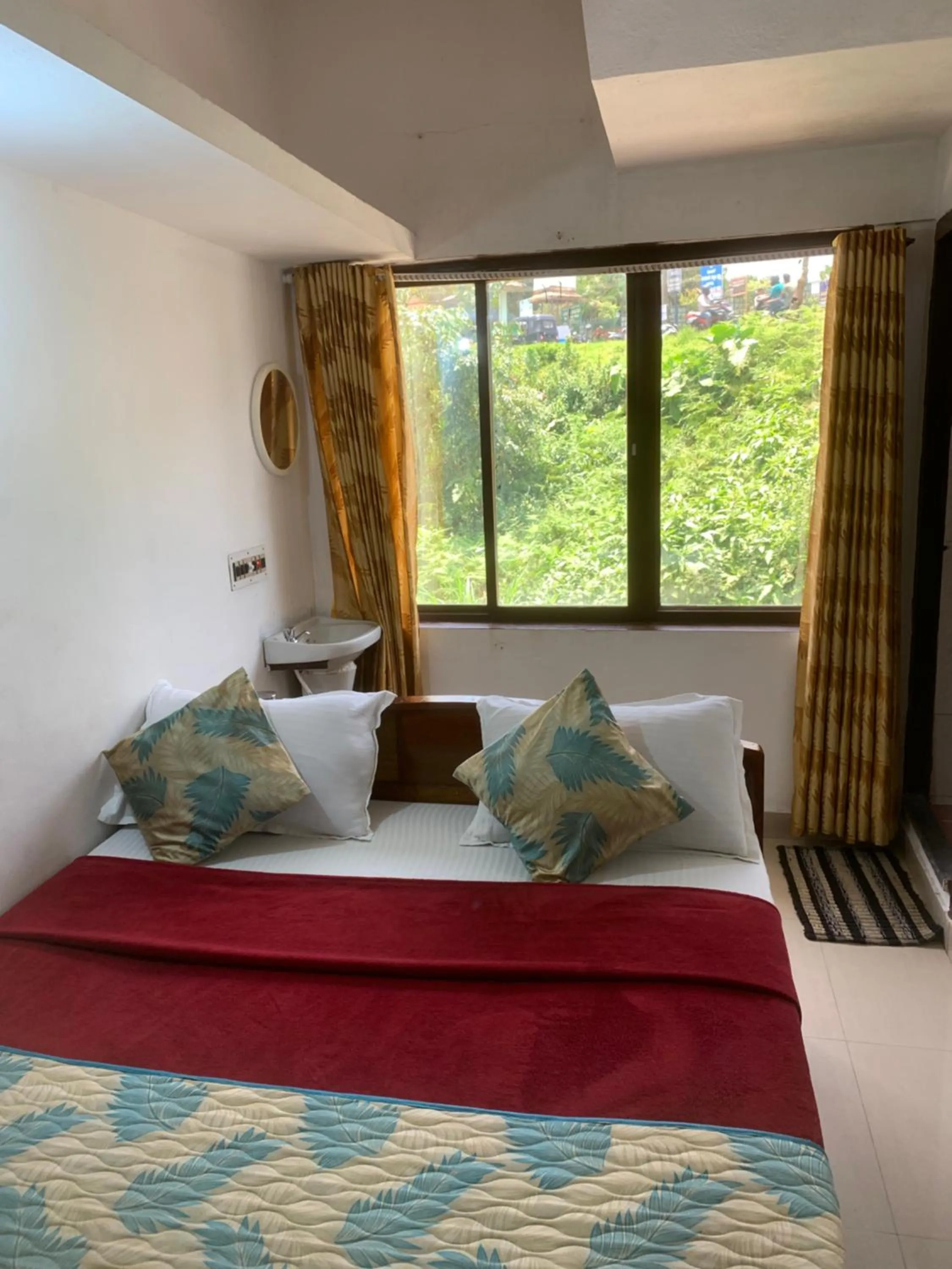 Bed in Hotel Caveri Inn