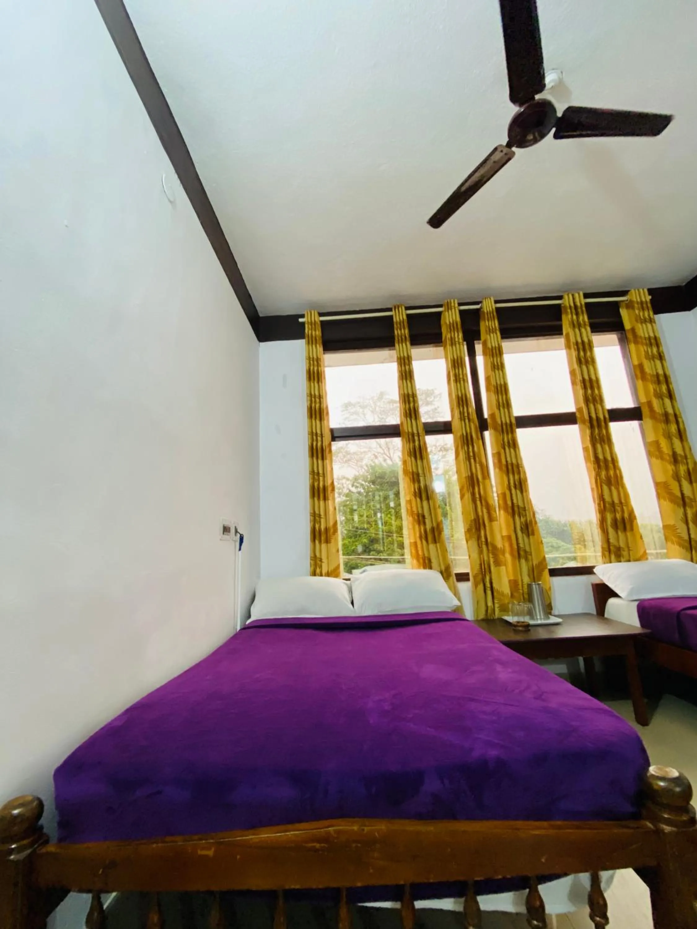 Bed in Hotel Caveri Inn