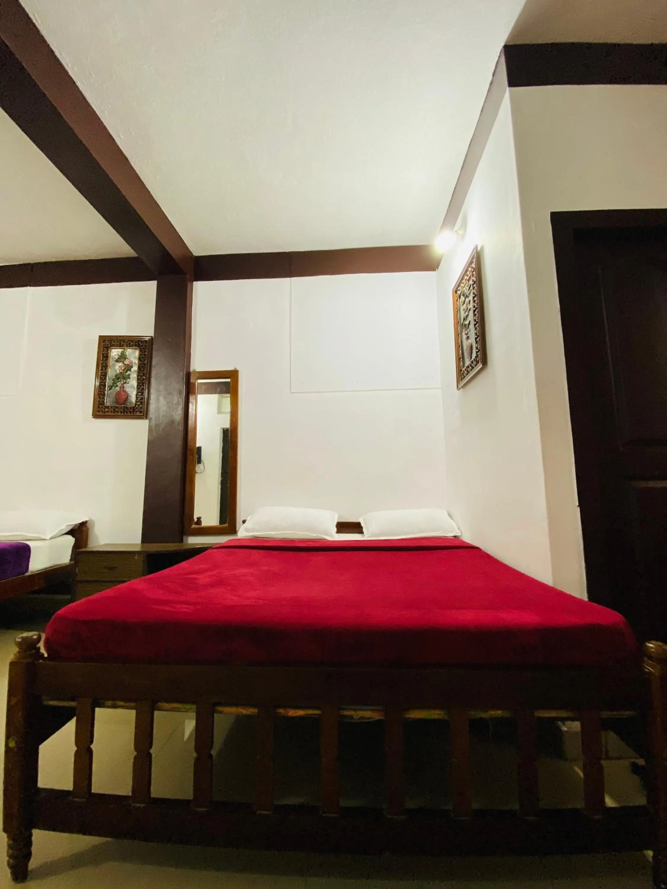 Bed in Hotel Caveri Inn