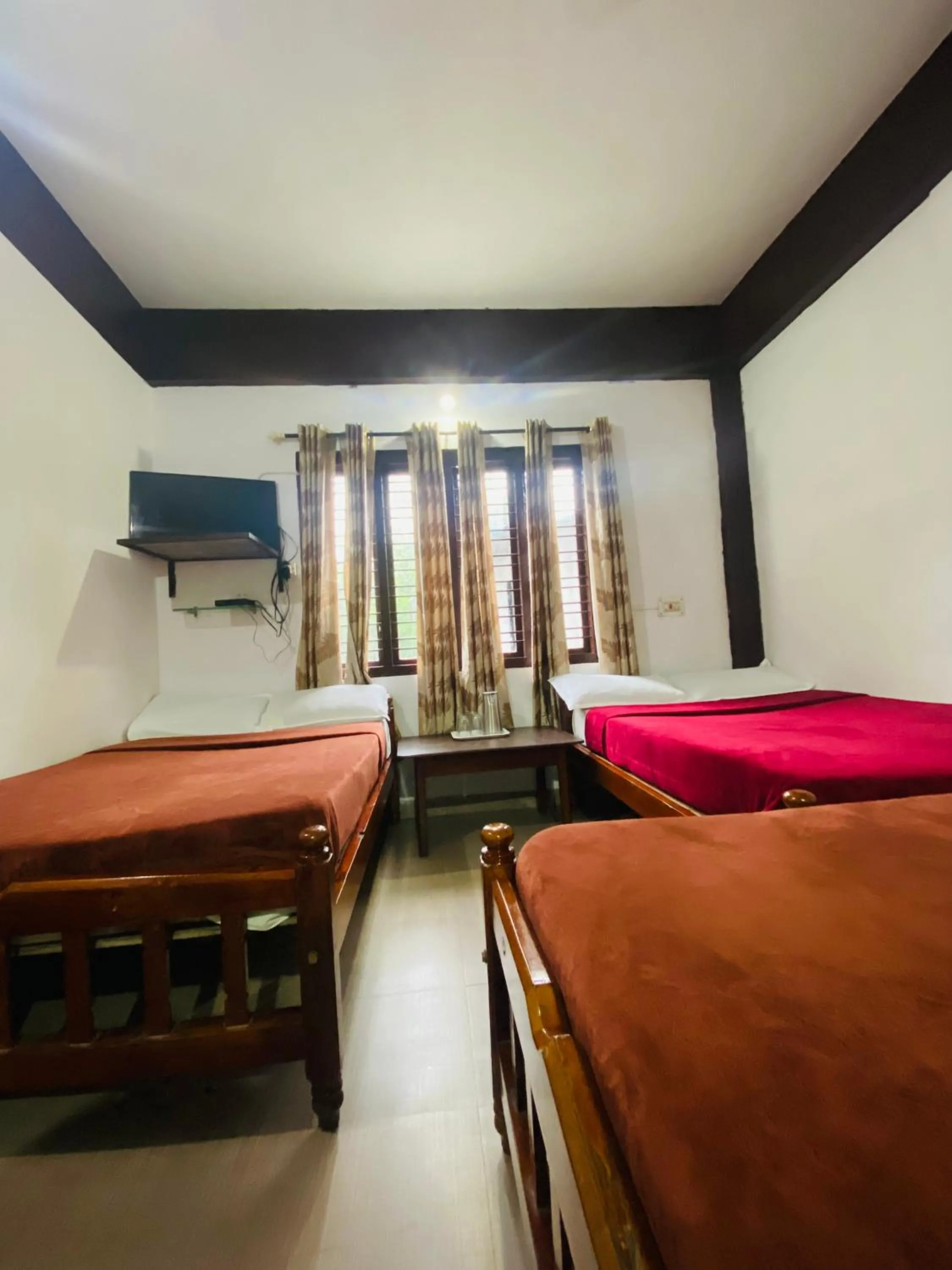 Bed in Hotel Caveri Inn