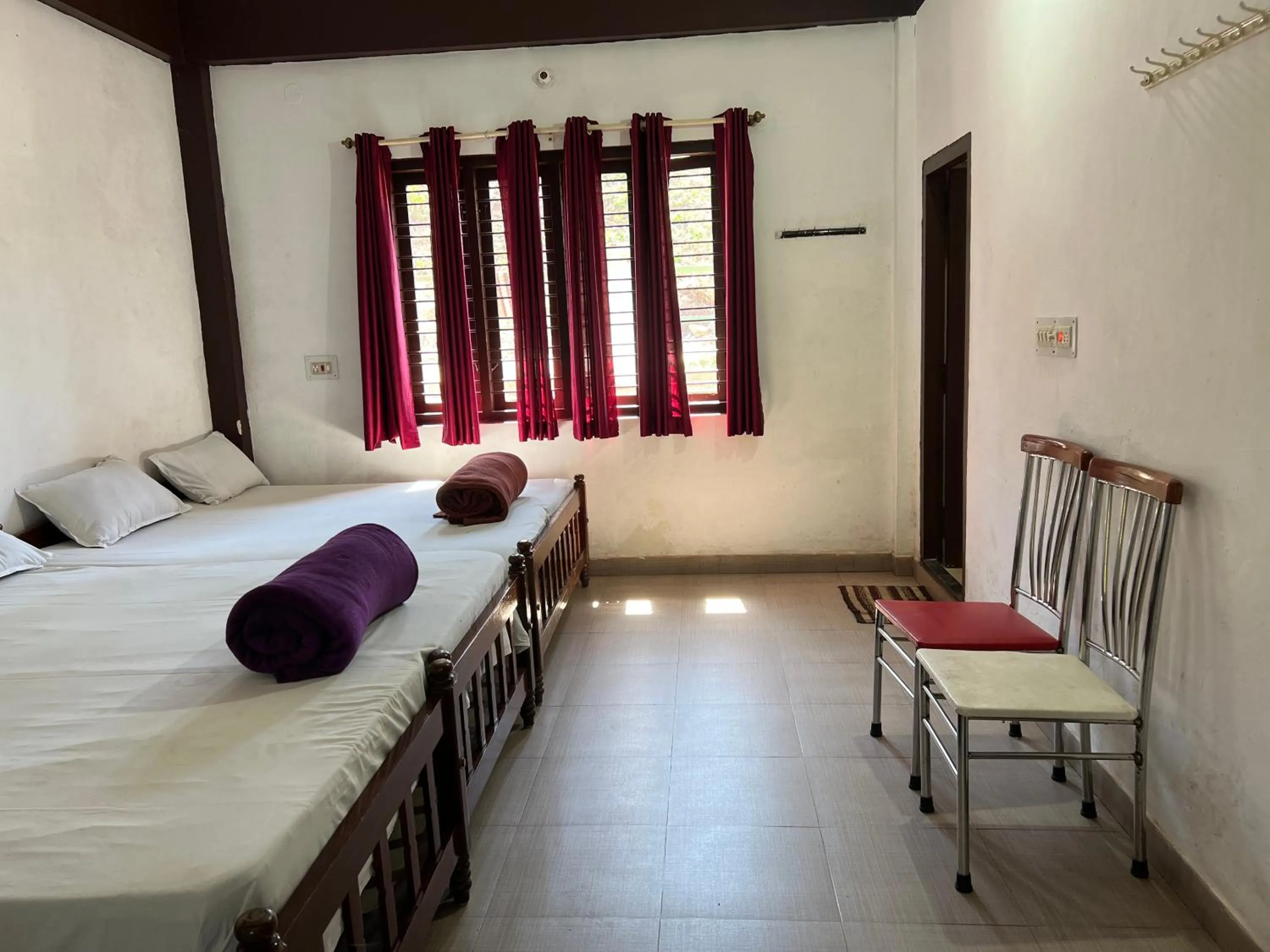 Bed in Hotel Caveri Inn