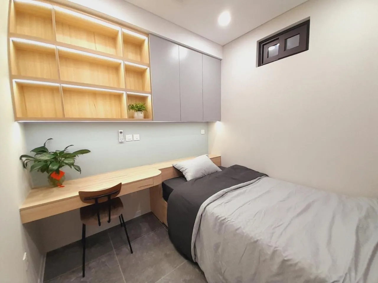 Bed in TSQ STAY Hotel Apartment