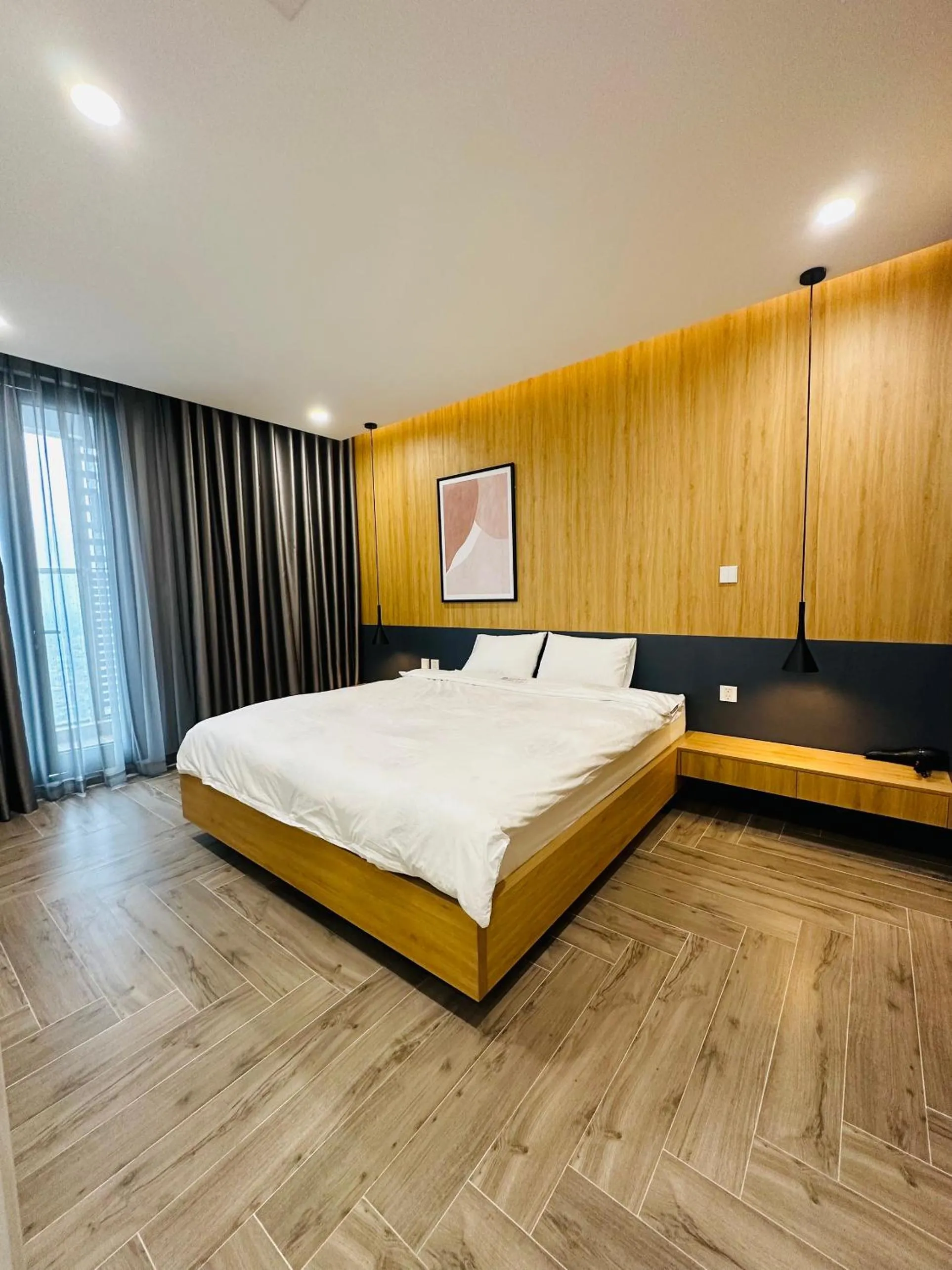 Bed in TSQ STAY Hotel Apartment