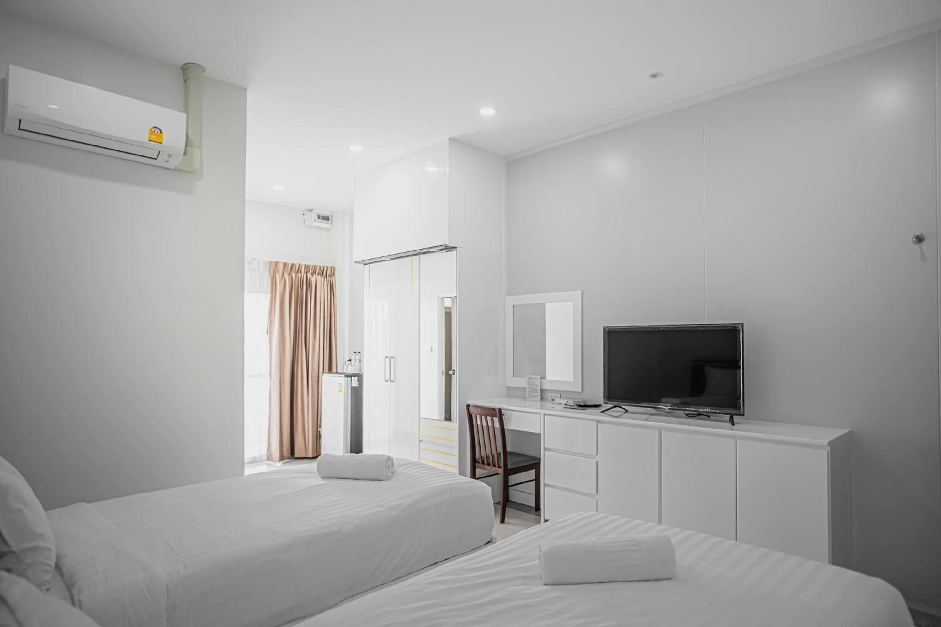 Bed in PT Grand Hotel