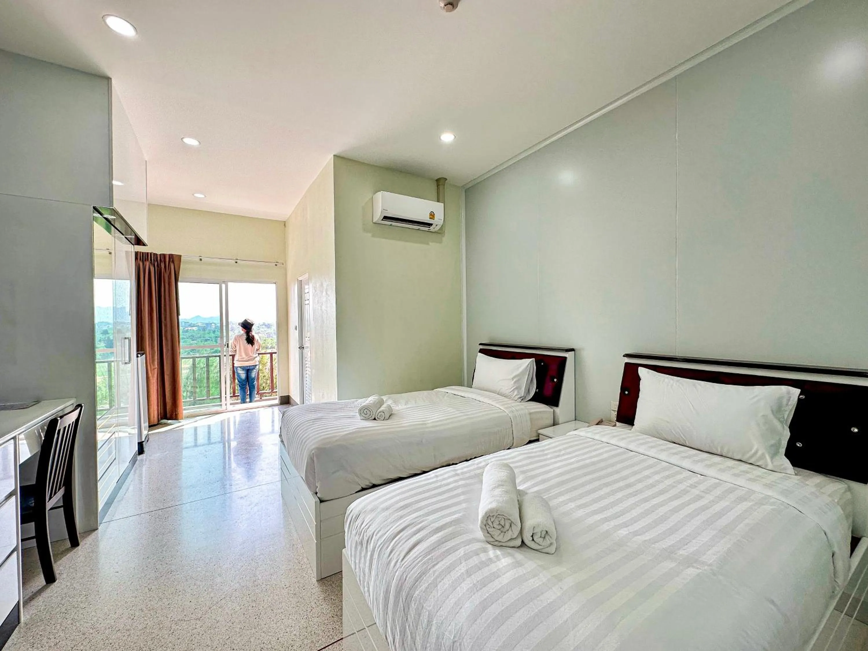 Bed in PT Grand Hotel